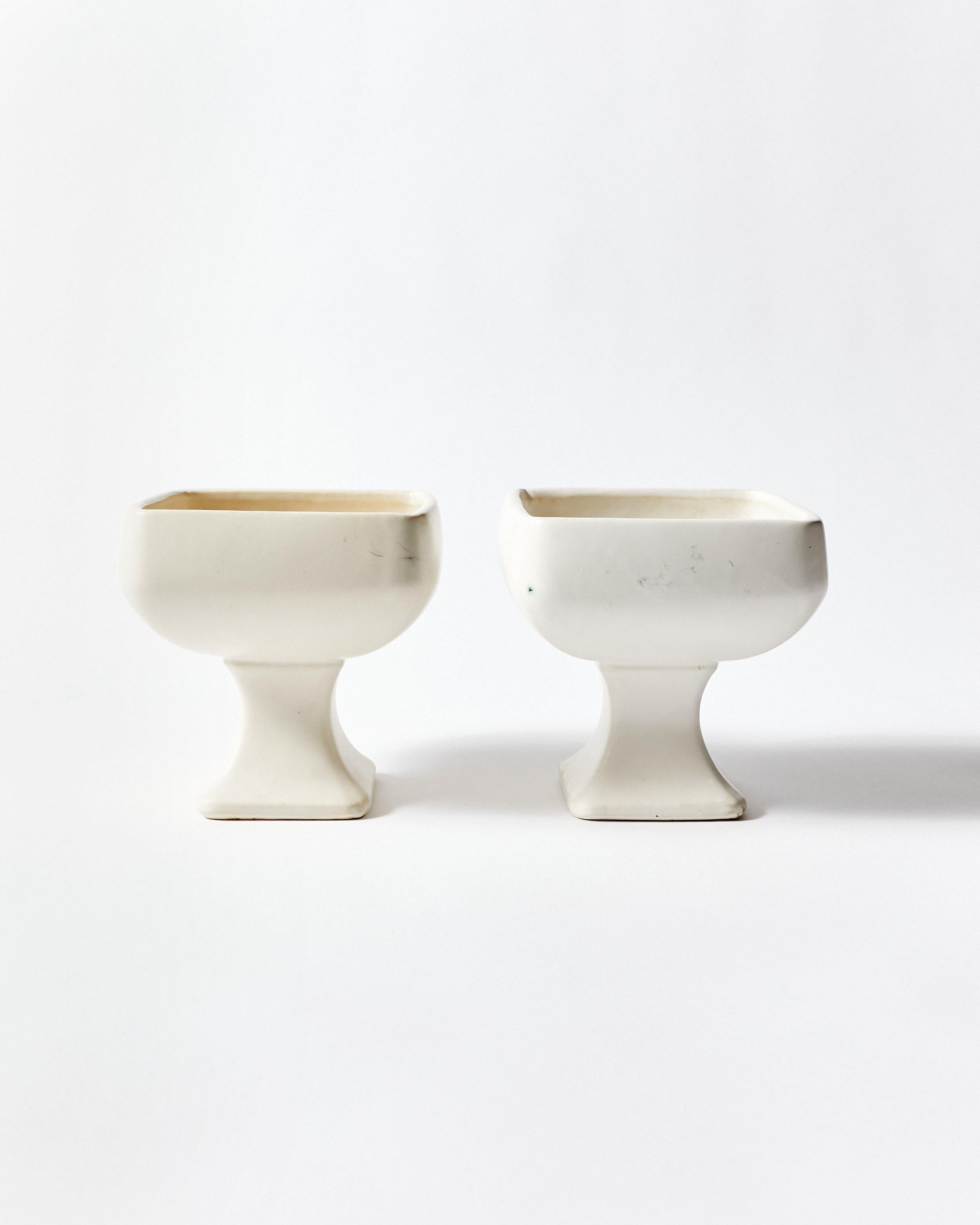 Set of two white ceramic vases designed by Nelson McCoy for Floraline in 1960.