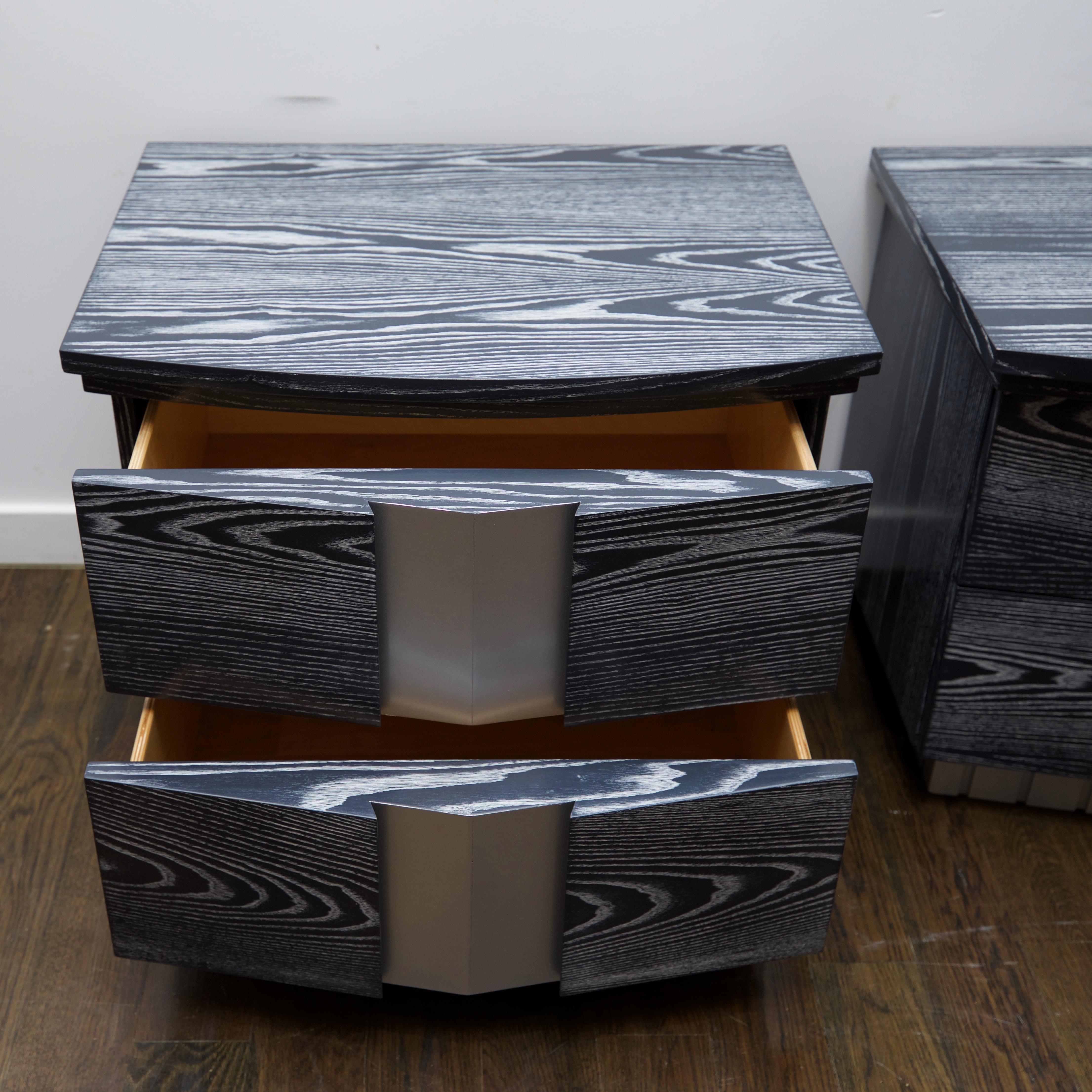Heavy, well-constructed set of oak, two-drawer end table/night tables that have been updated in a beautiful grey and white ceruse, with silver accents.