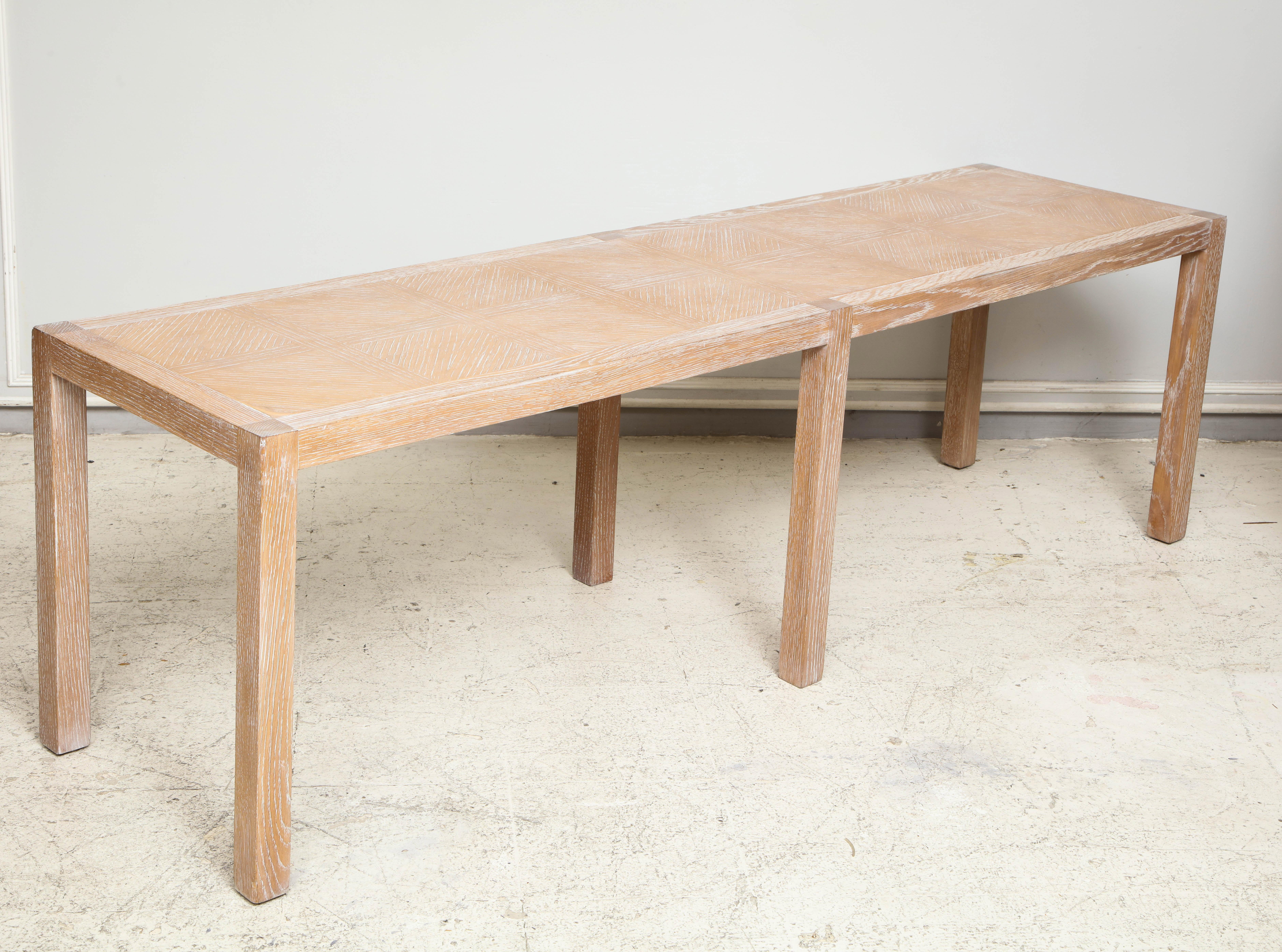 Pair of cerused oak parquetry long benches (also sold separately).