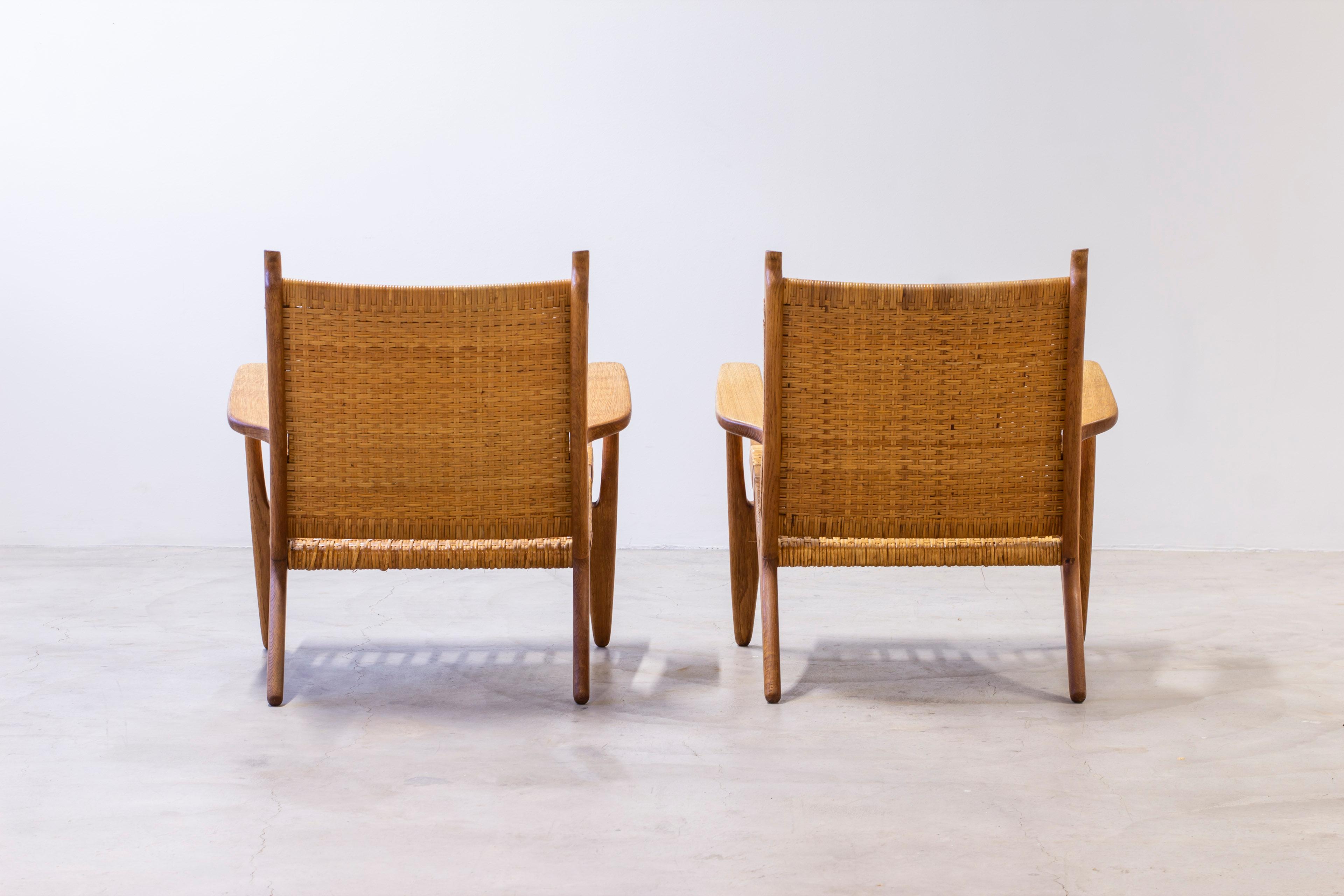 Pair of CH-27 oak and cane weave lounge chairs by Hans J. Wegner, Carl Hansen For Sale 5