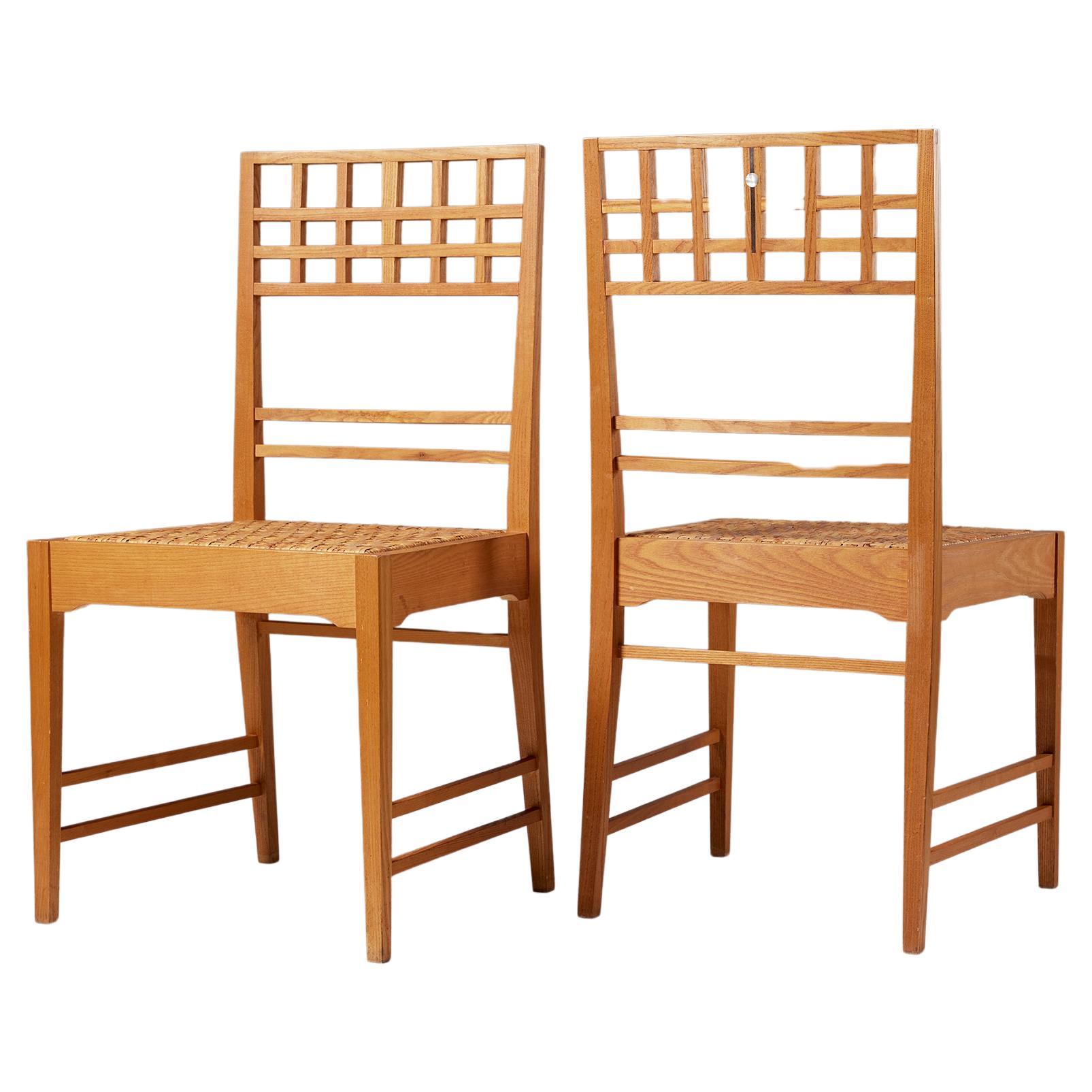 Pair of chairs attributed to Erik Chambert, Sweden, 1950s, mother of pearl inlay