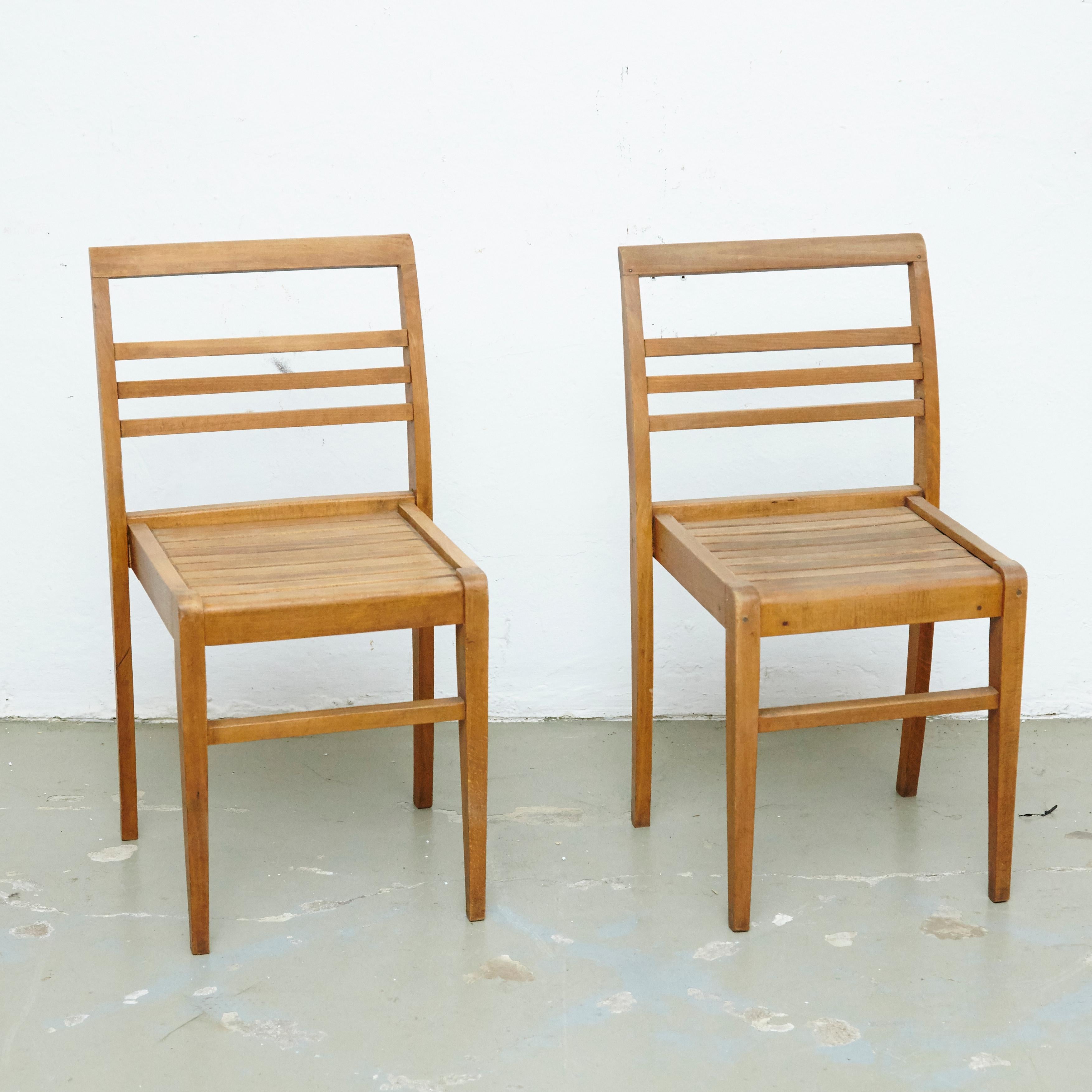 Chairs designed by Rene Gabriel, circa 1946.
Manufactured in France, circa 1946.
Oak wood base and structure.

In good original condition, with minor wear consistent with age and use, preserving a beautiful patina.

René Gabriel (1890–1950)
