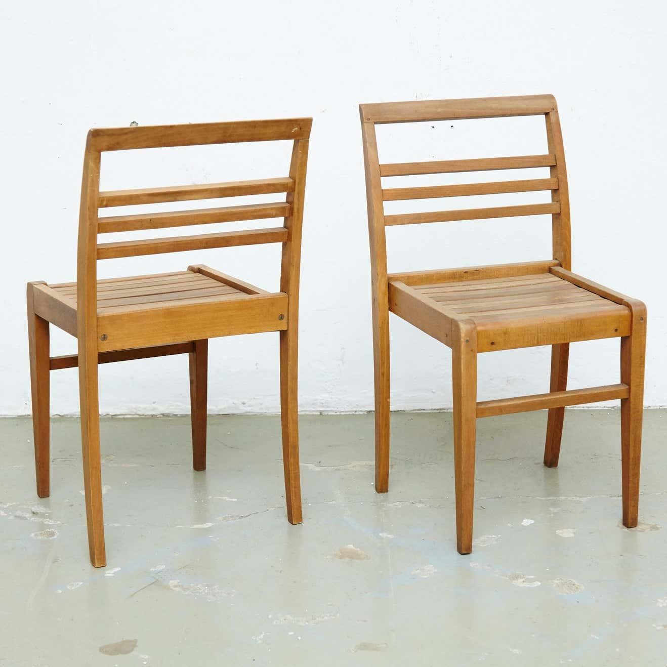 Chairs designed by Rene Gabriel, circa 1946.
Manufactured in France, circa 1946.
Oak wood base and structure.

In good original condition, with minor wear consistent with age and use, preserving a beautiful patina.

René Gabriel (1890–1950)