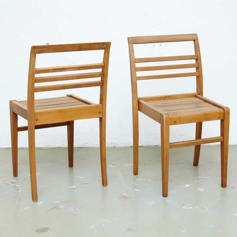 Chairs designed by Rene Gabriel, circa 1946.
Manufactured in France, circa 1946.
Oak wood base and structure.

In good original condition, with minor wear consistent with age and use, preserving a beautiful patina.

René Gabriel (1890–1950) was a
