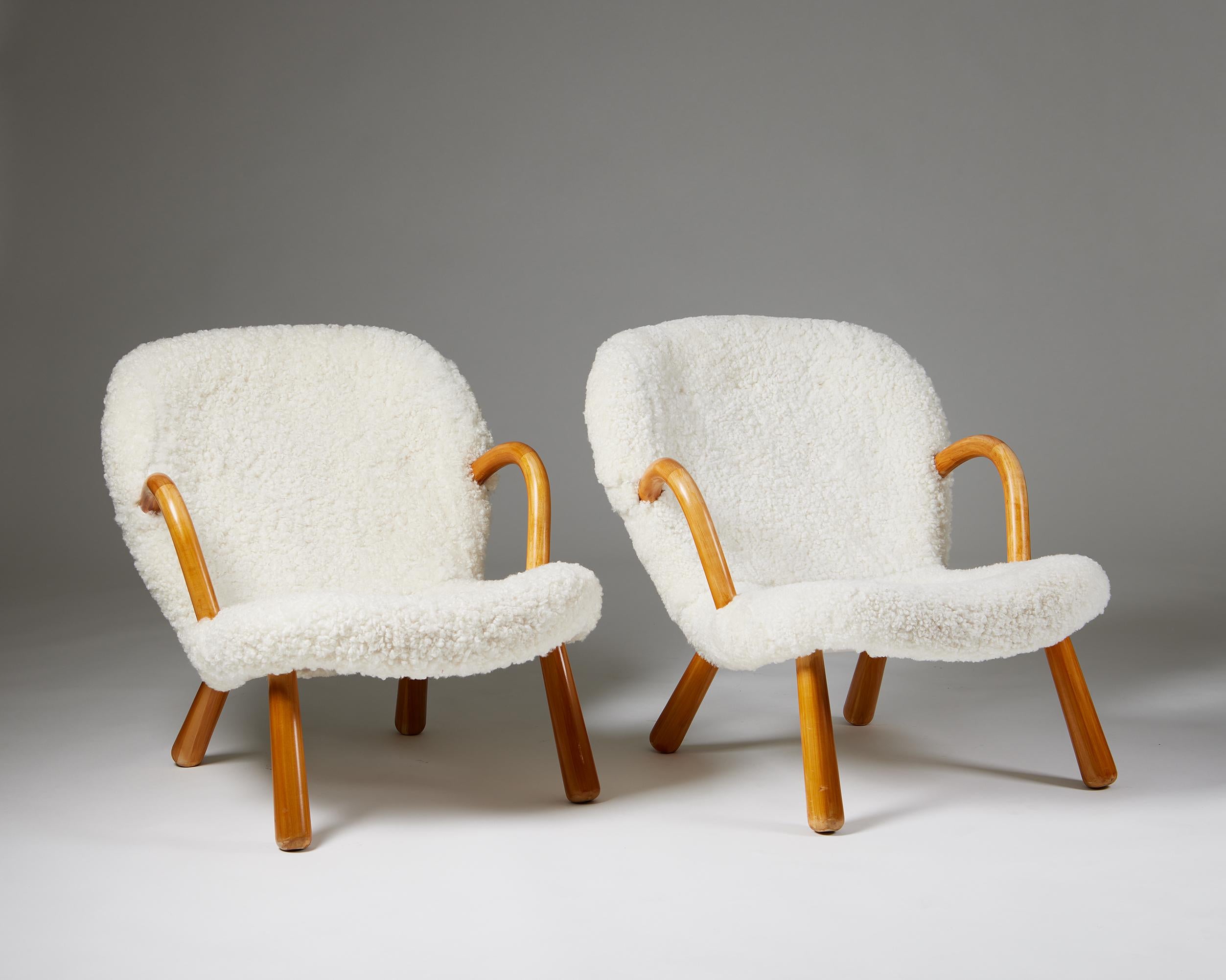 Pair of chairs ‘Clam’ designed by Arnold Madsen for Madsen & Schubell,
Denmark. 1944.
Birch and sheepskin upholstery.

A design with a rather perplexing, yet fascinating history, it has been attributed to several designers before, the latest