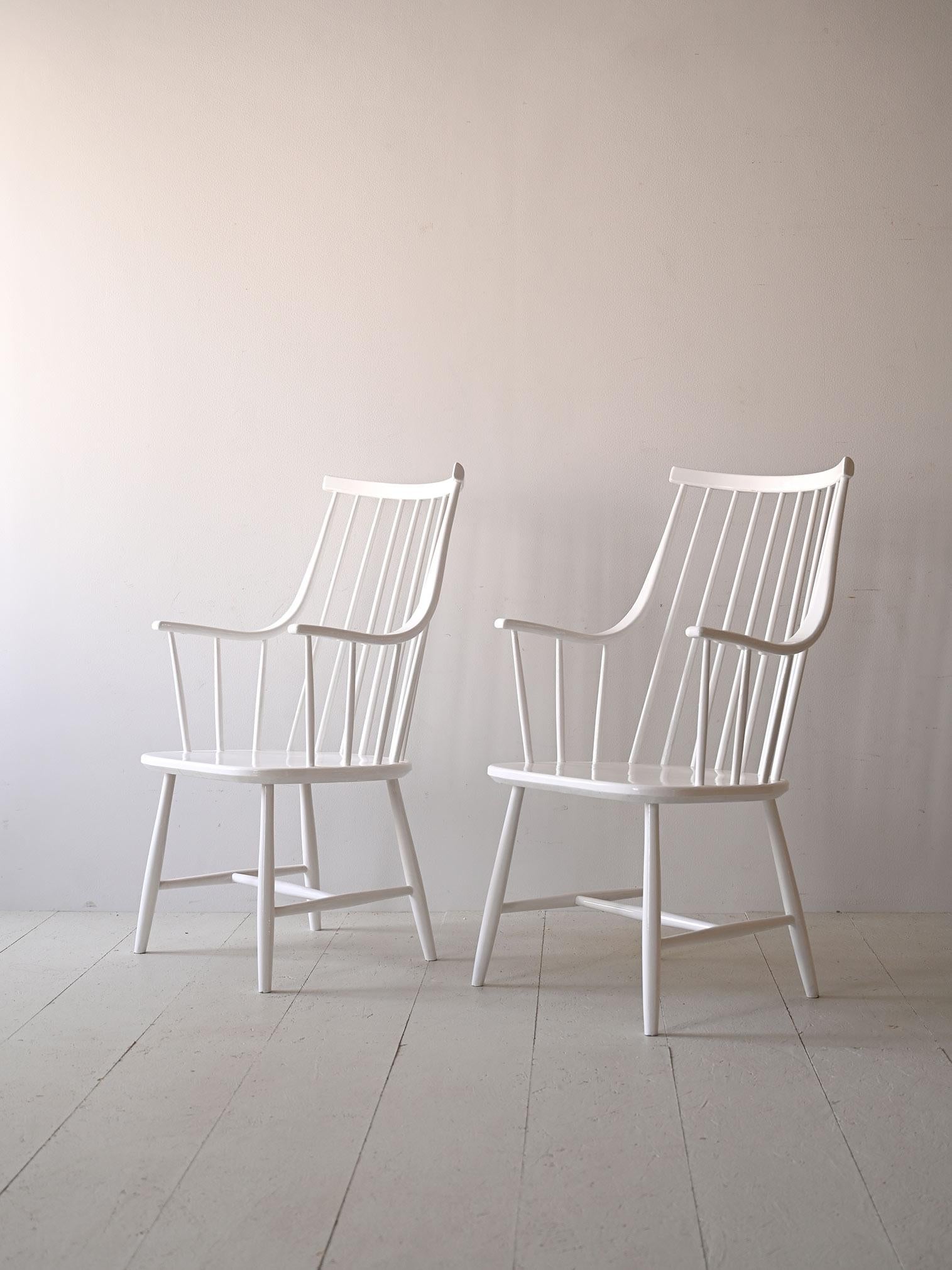 Wooden chairs with original vintage armrests model 'Grandessa' designed by designer Lena Larsson in the 1950s.
The frame is painted white and has the original stamp.

Good condition. A conservative restoration has been done. It may show some signs