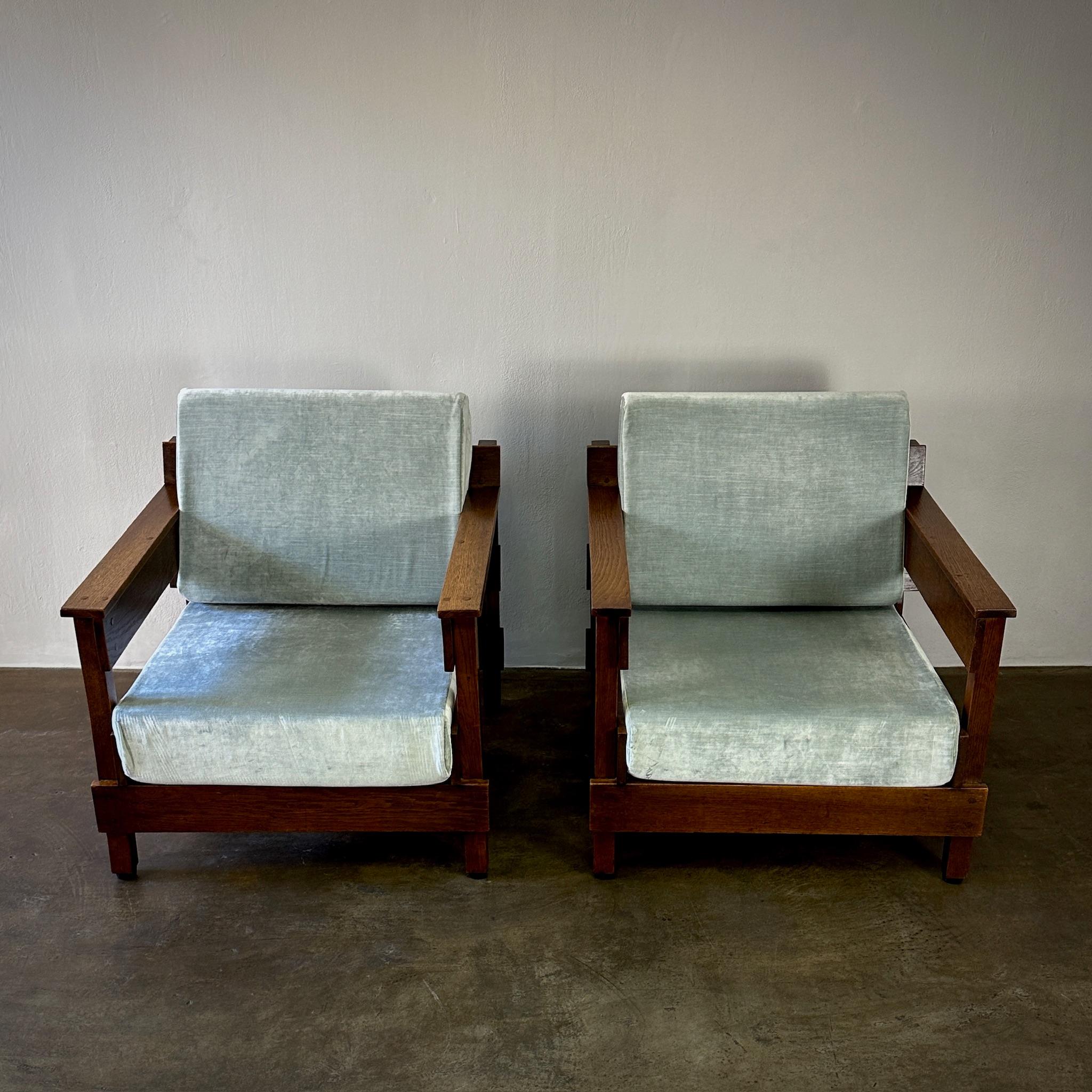 Pair of large Dutch 1940s lounge chairs with architectural modernist wood frameworks celadon velvet upholstered cushions. Nostalgic yet forward facing.
Netherlands, circa 1940
Dimensions: 32.5W x 35D x 26.5H (seat height 17)