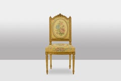 Pair of chairs in gilded wood and tapestry. Louis XVI period