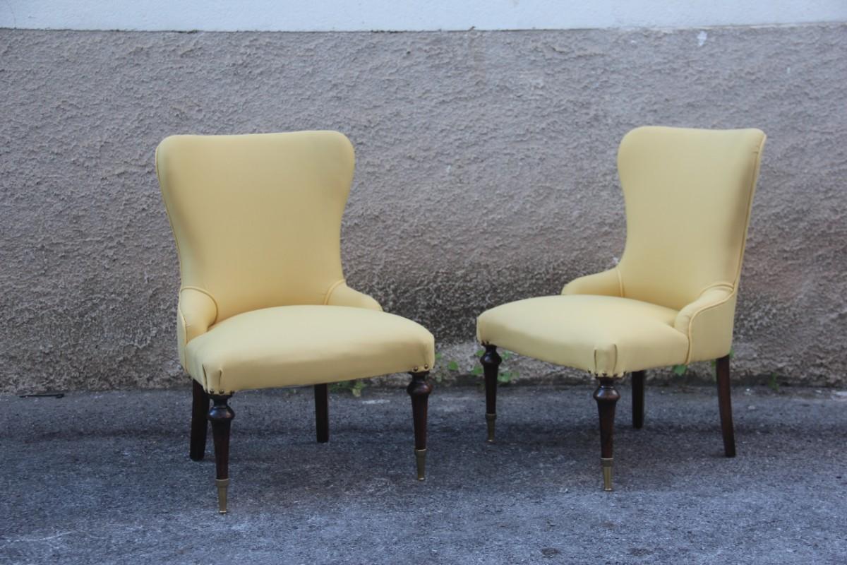 Pair of chairs Mid-Century Modern Italian design Yellow color wood and brass feet.
 