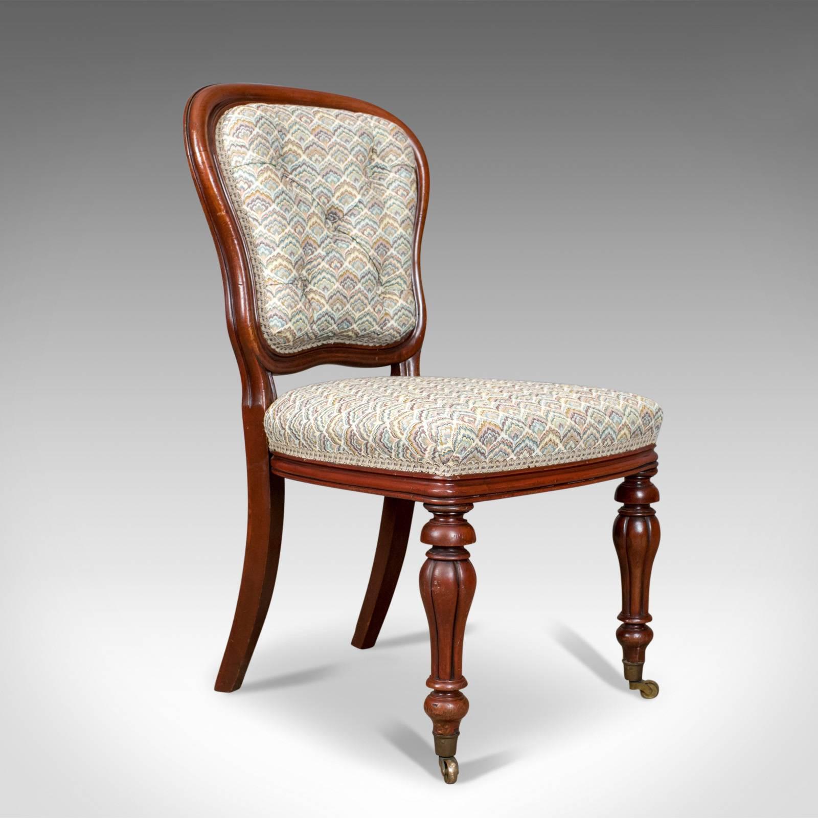 This is an antique pair of chairs, two English, William IV, mahogany button back parlour, or side, chairs dating to circa 1835.

Of quality craftsmanship and in fine order
Deep, dark, lustrous, mahogany frames
Traditionally stuffed and