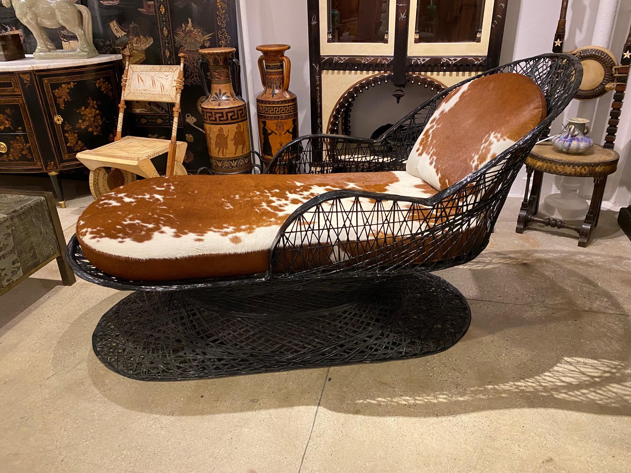 Pair of chaise longue in lacquered resin and cowhide by Russel Woodard.