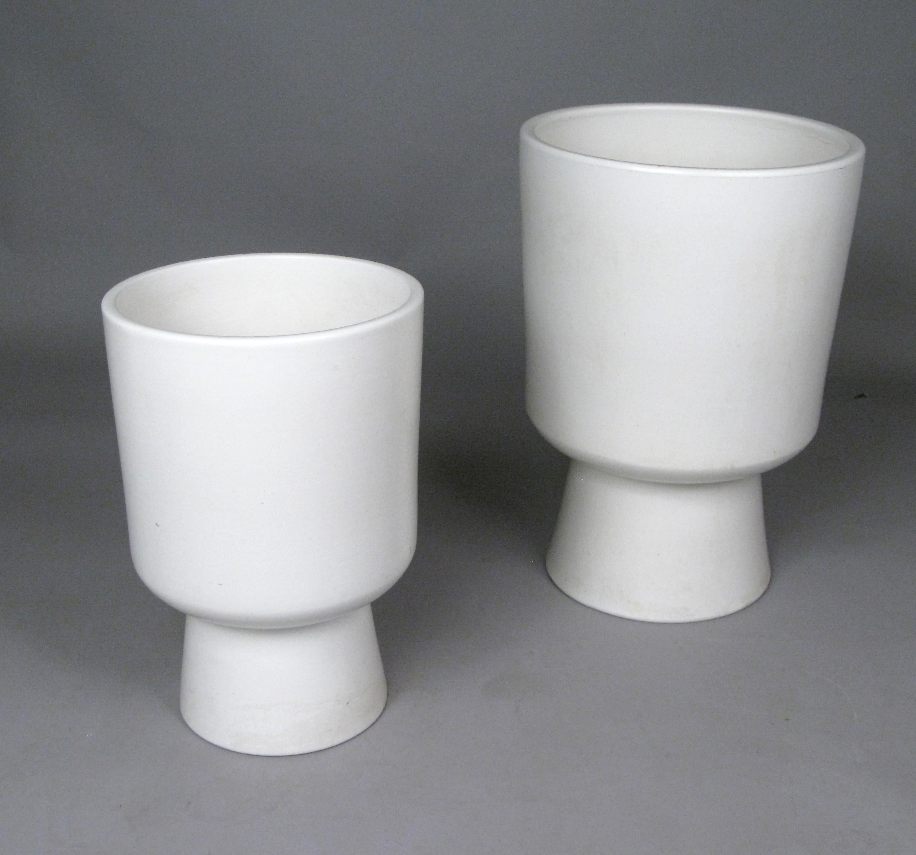 A beautiful companion pair of vintage 1960s 'Chalice' planters, one very large, and the other medium sized, designed by Malcolm Leland for Architectural Pottery. Both in matte white glaze ceramic, these are the most classic of Leland's designs. The