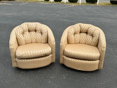 Pair of Champagne Colored Swivel Chairs