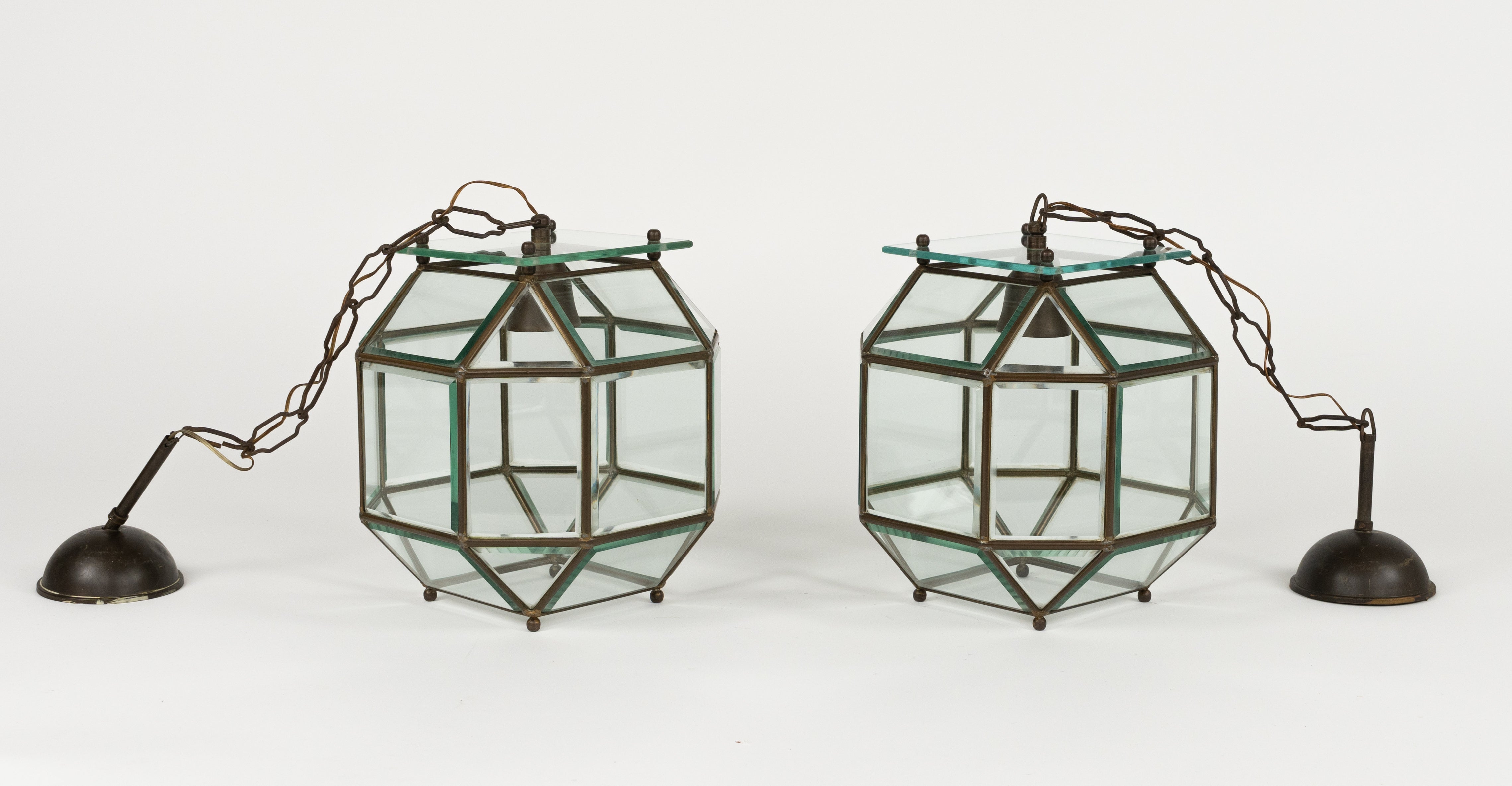 Midcentury amazing pair of chandelier lantern in brass and beveled glass in the style of Adolf Loos.  

Made in Italy in the 1950s.  

The stunning and clear cut pendant shows twenty-four facetted clear glasses in a brass frame.   

Measures: 