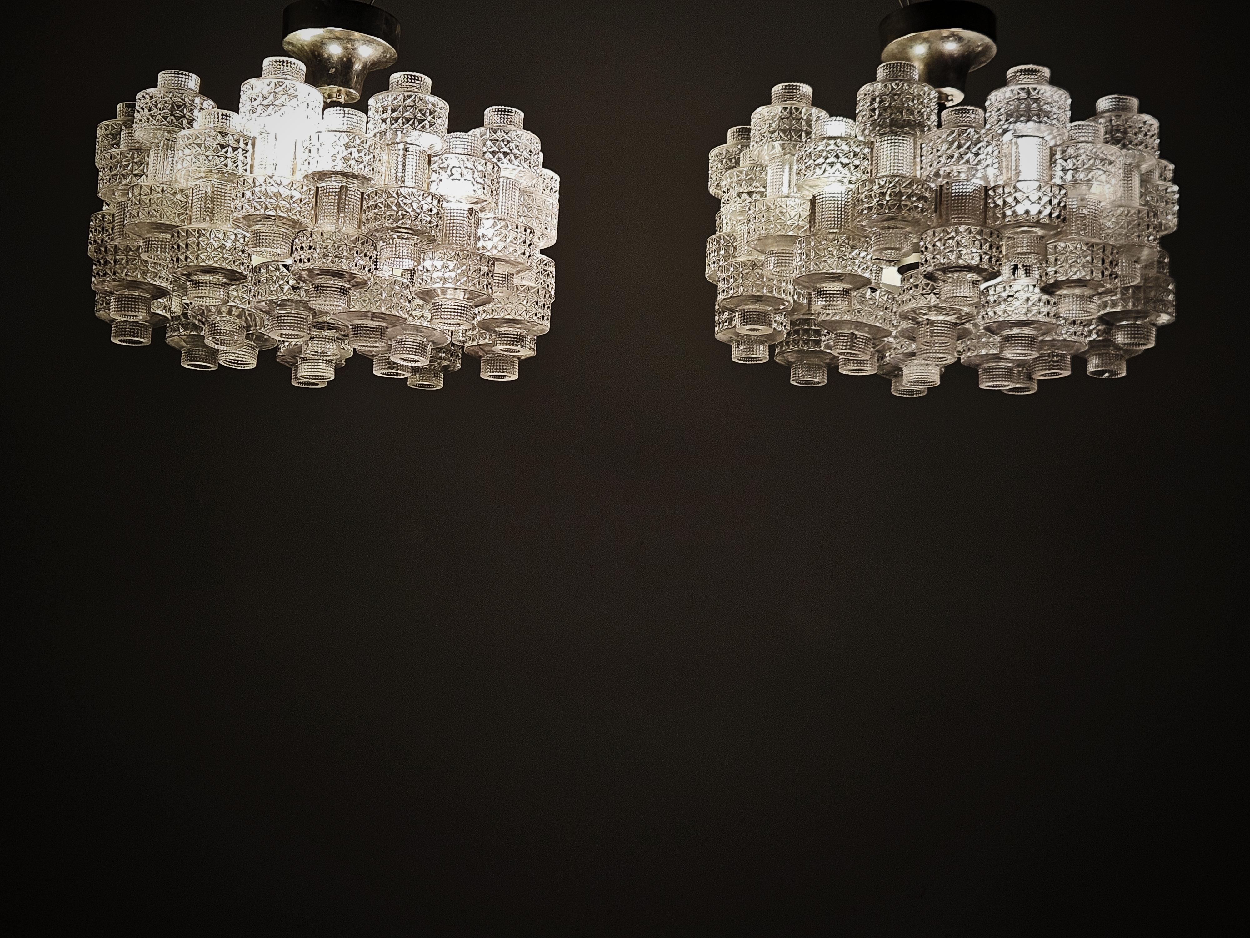 Swedish Pair of chandeliers 'Festival' by Gert Nyström for Fagerhult, Sweden, 1970s For Sale