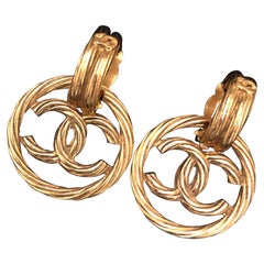 Pair of CHANEL Gold Toned CC Dangle Earclips Clip On Earrings