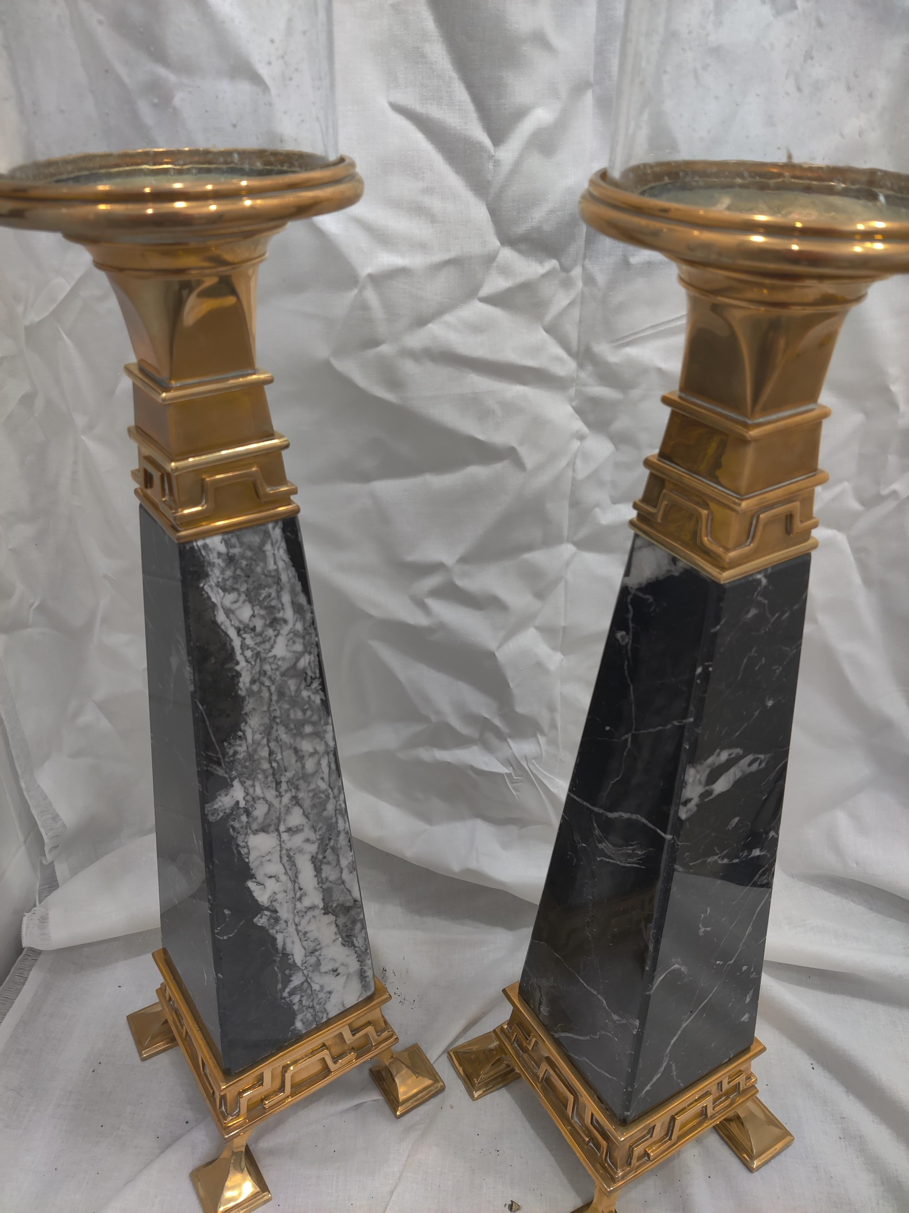 Pair of Chapman Brass and Marble Obelisks
Solid black marble with white
Glass shades have small bubbles, slightly frosted
Possibly would accept being wired with electric.
Looks brand new