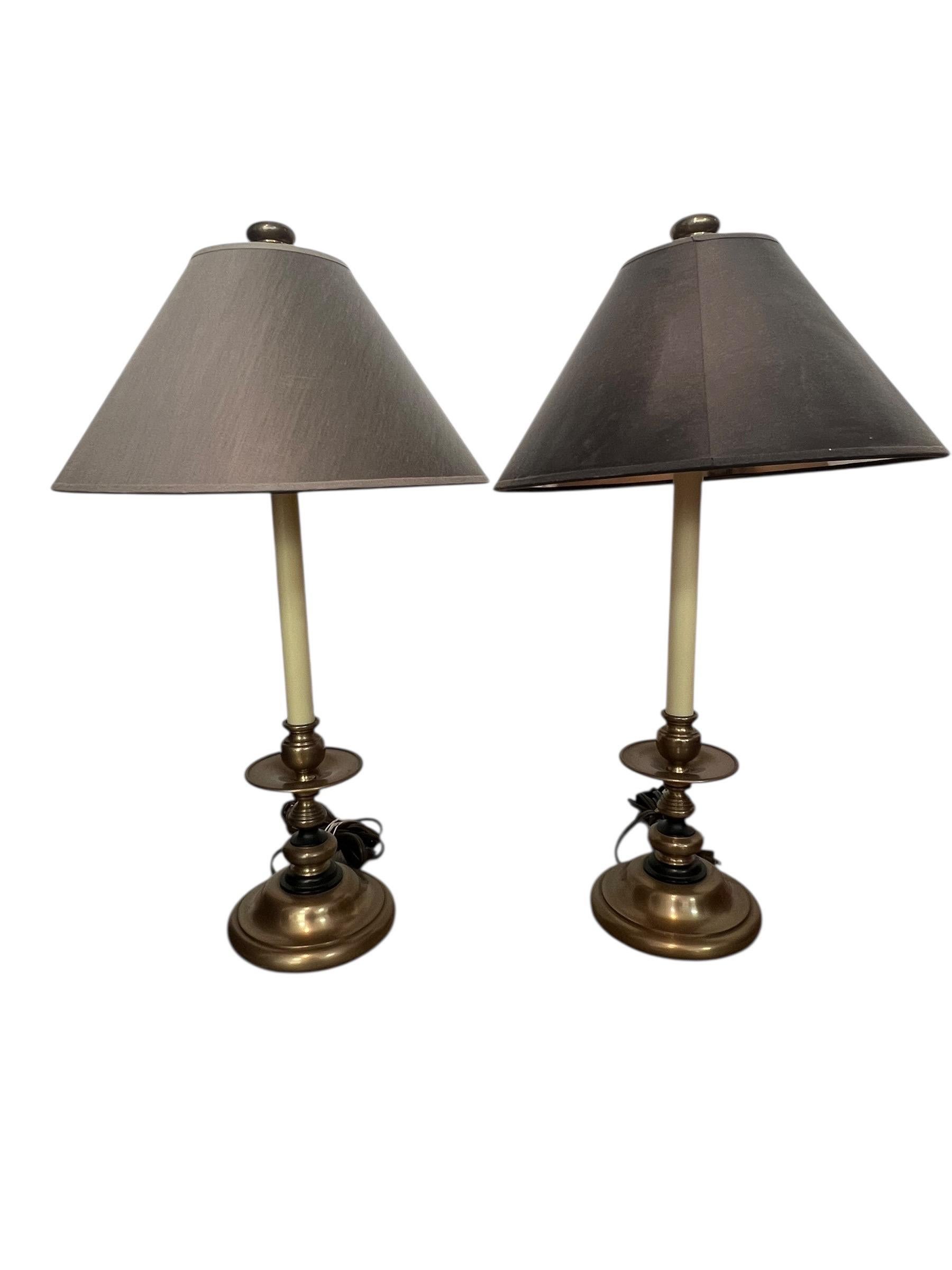 This is a nice pair of Chapman brass table or buffet lamps.  Neoclassical or Hollywood regency style.  Labels on the bottom with a 1986 patent date.   They are in nice vintage condition, with what I believe are the original shades which are grey