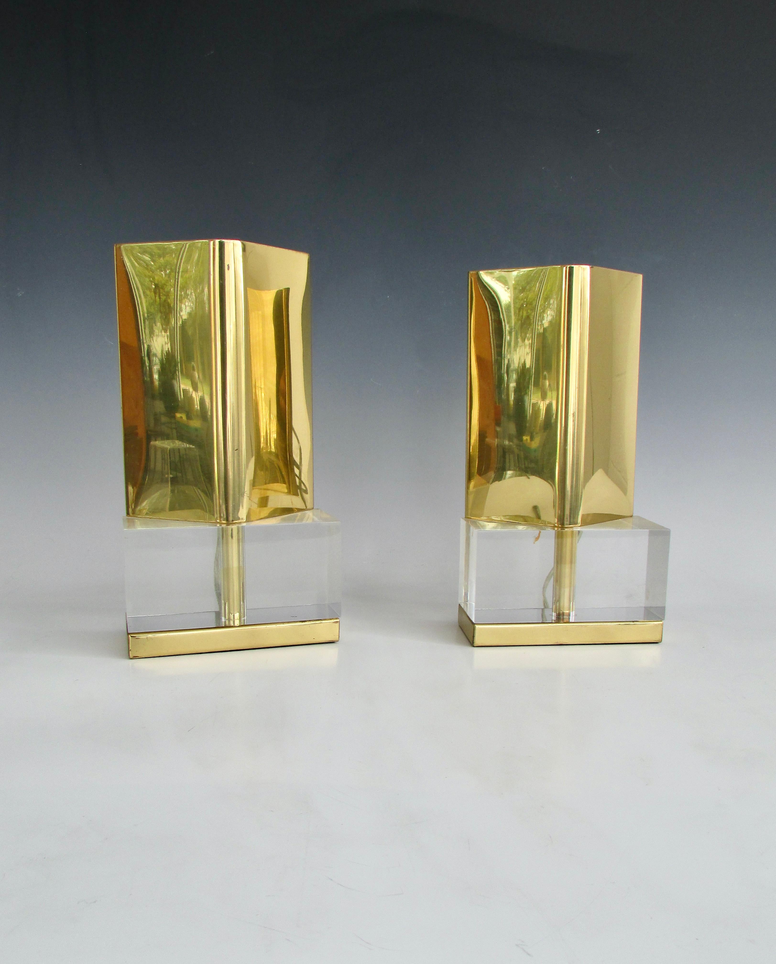 Brass Cedric Hartman style deflectors mounted on Lucite bases. Joined together to create these table top or shelf mounted sconces. Retain original Chapman label.