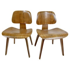 Pair of Charles and Ray Eames Herman Miller Calico Ash DCW chairs