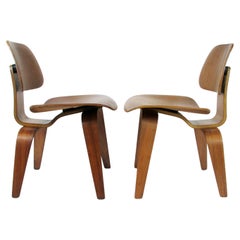 Pair of Charles and Ray Eames Herman Miller Walnut DCW chairs