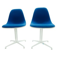 Pair of Charles and Ray Eames La Fonda Chairs with Cream White Fiberglass Shells
