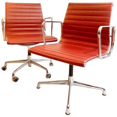 Pair of Charles and Ray Eames Office Chairs in Red Leather