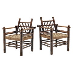 Pair of Charles Dudouyt Art Deco Lounge Chairs in Solid Oak and Papercord