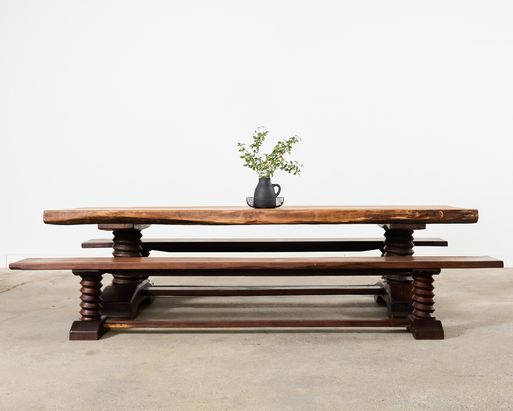 Rare mid-century modern oak trestle corkscrew dining benches attributed to French designer Charles Dudouyt (French 1885-1946). The massive benches are nearly 10 feet long and feature a trestle style with iconic corkscrew or twist legs ending with