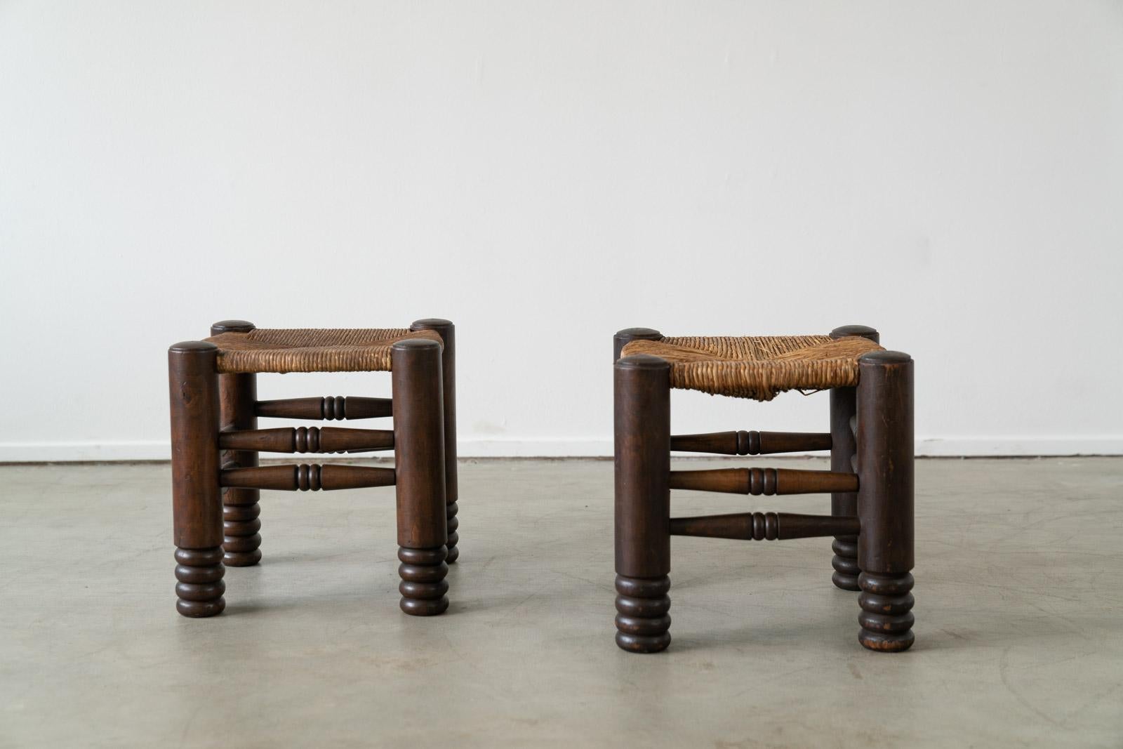 Pair of Charles Dudouyt stool with signature carved legs and woven seat. 
France, circa 1940's
Great patina to seat. 
Priced as a pair.