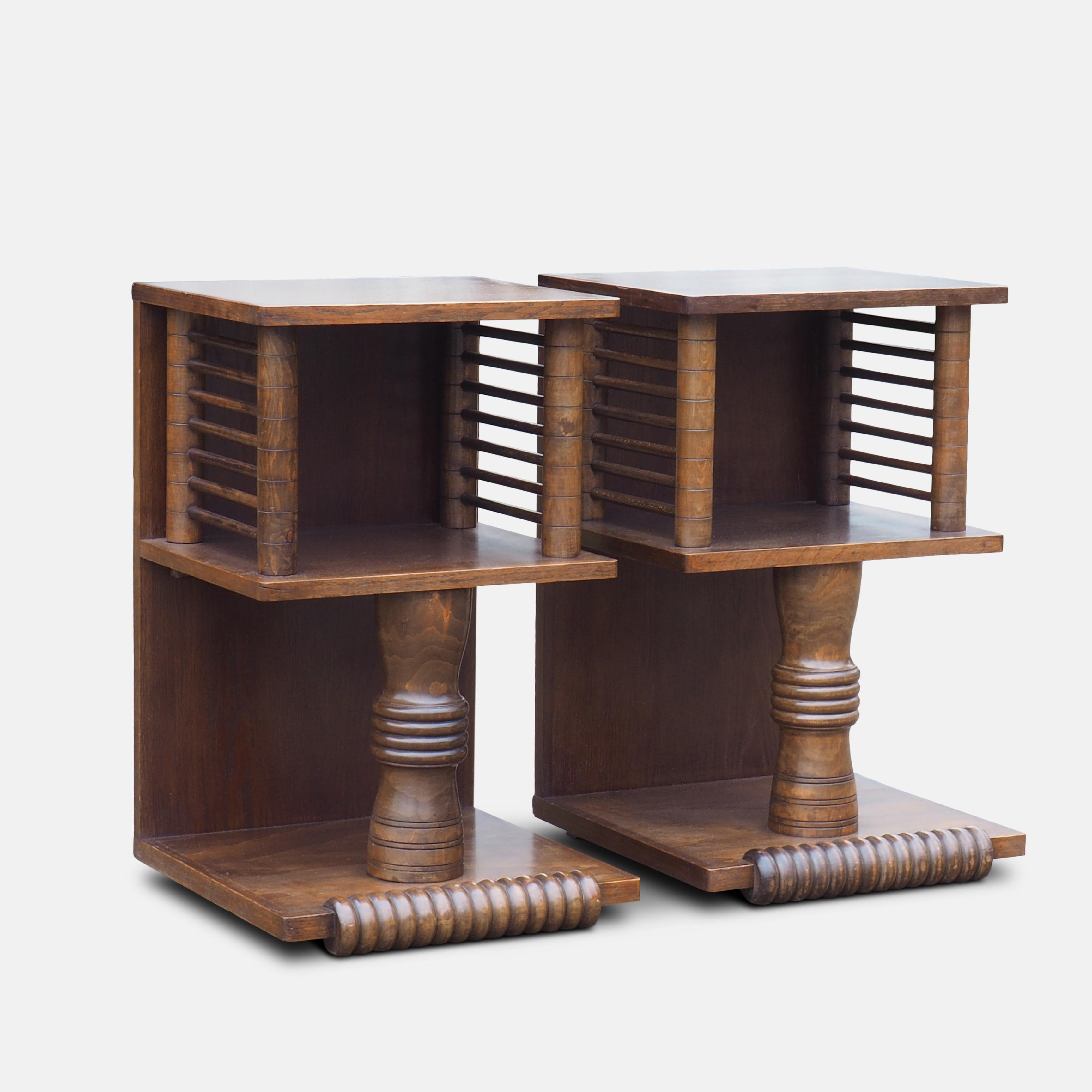 Pair of Charles Dudouyt (1885-1946) French tables, circa 1930.
Strongly influenced by African art, these richly carved tables mark a move form Art Deco to the bold abstract forms of Picasso and the modern movement.

An important figure in early