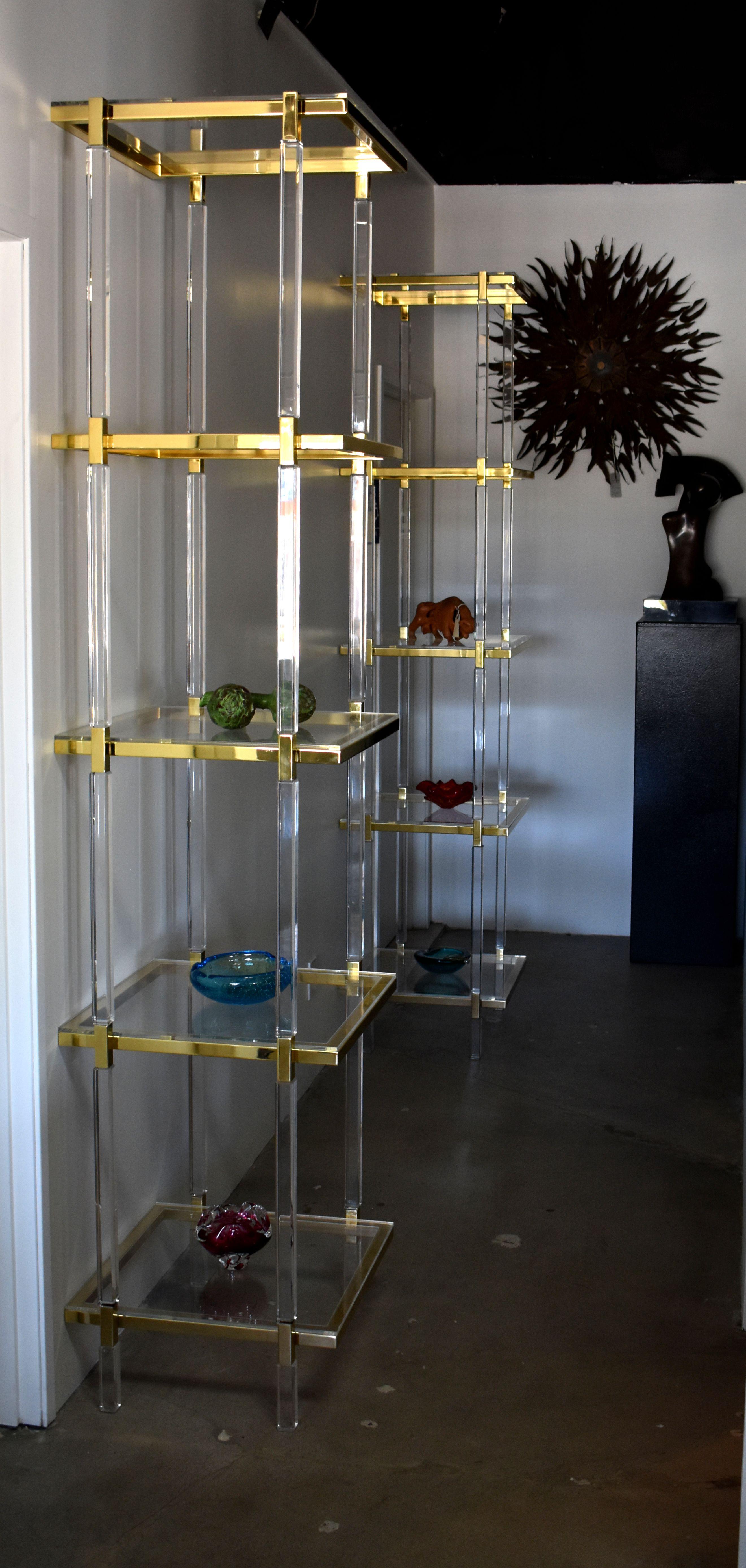 Pair of brass plated and lucite custom shelving display design and signed by Charles Hollis Jones
Each shelf is made of lucite.

Provenance directly from CHJ.

About Charles Hollis Jones:

Charles Hollis Jones is an American artist and furniture
