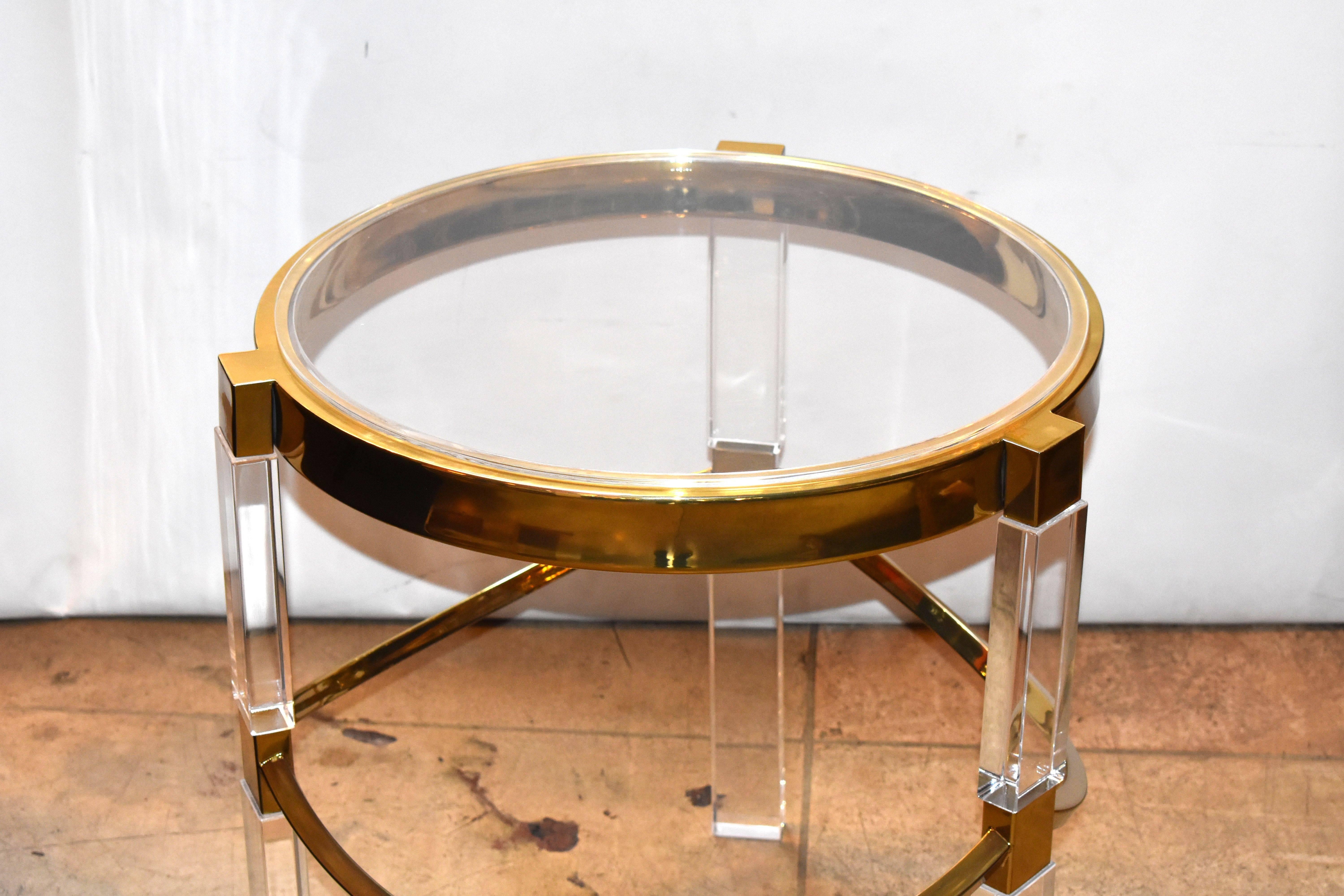 Regency style pair of Lucite and brass plated finish side tables design and signed by Charles Hollis Jones.