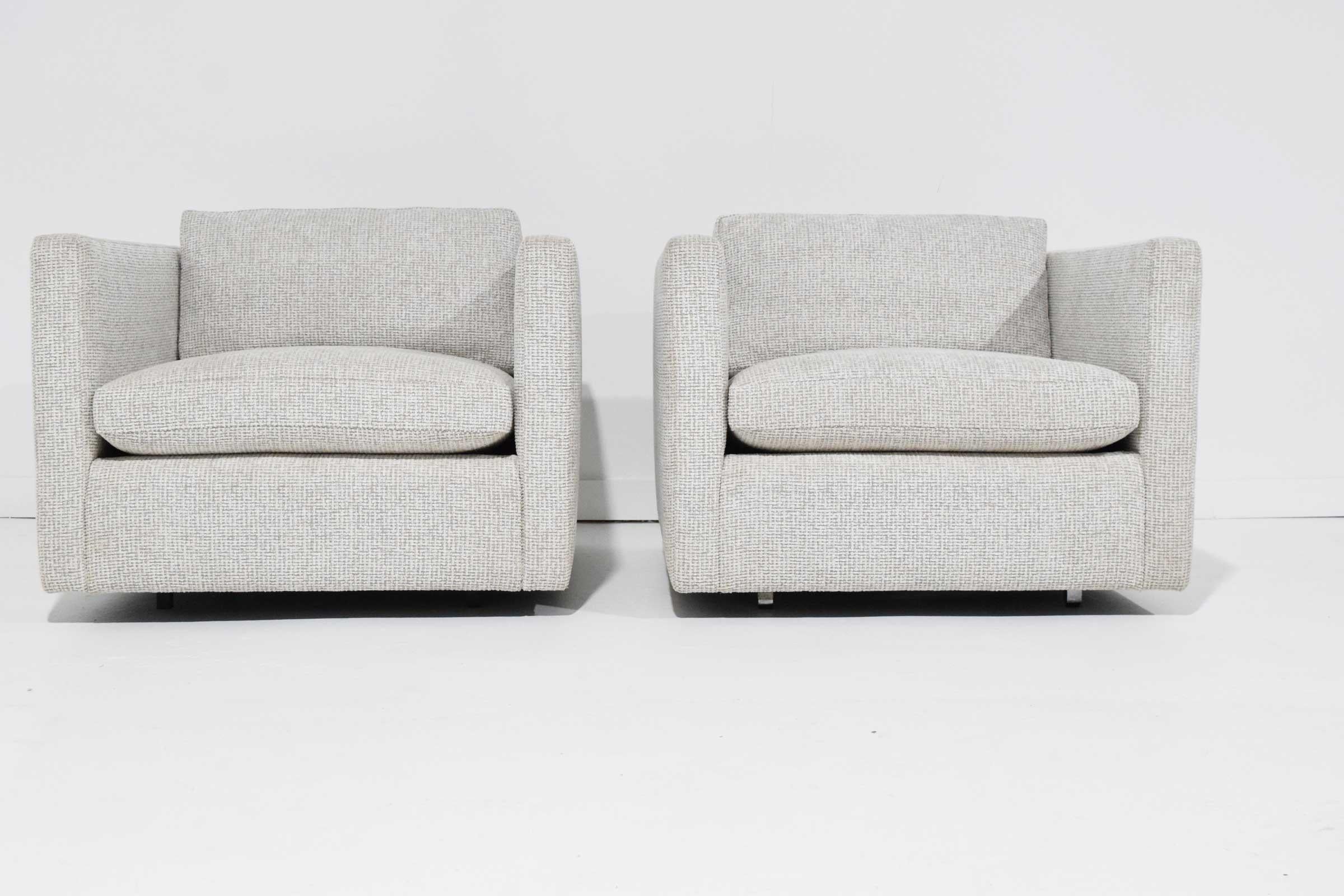 Newly upholstered in a taupe/white weave chenille, these Charles Pfister lounge chairs are a great scale, shape and comfortable.