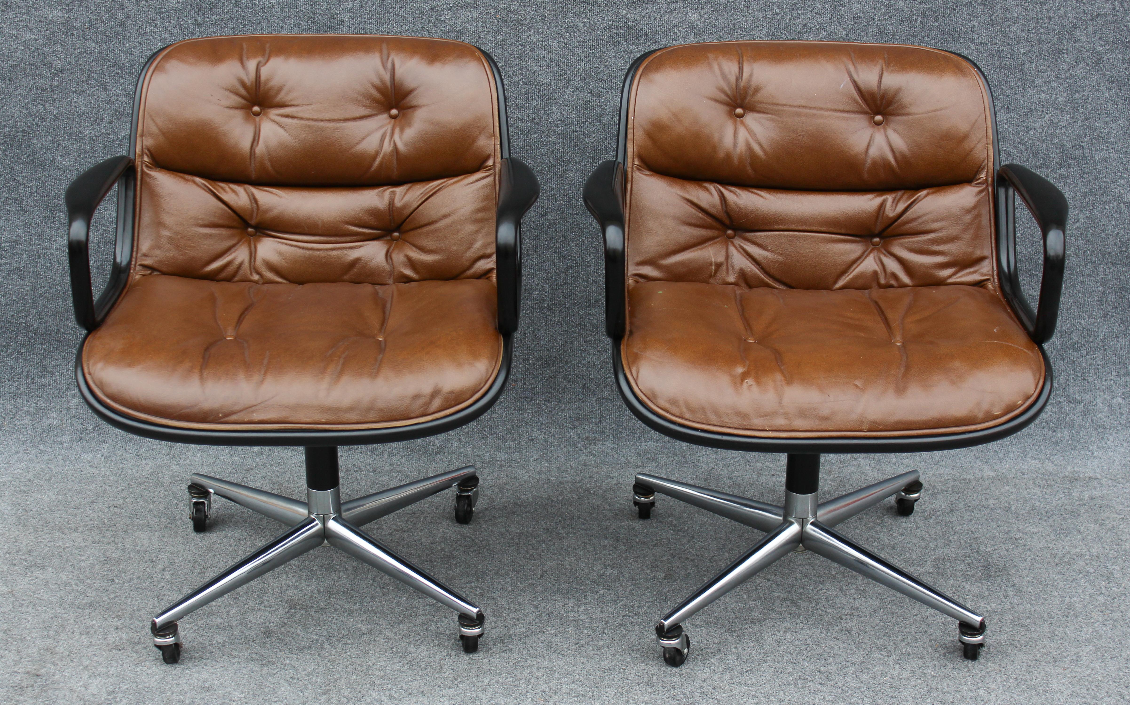 For your consideration: a pair of Charles Pollock for Knoll Armchairs. The chairs have dark brown leather and a black enameled outer frame and feature ovoid shaped four-star bases. All chairs have castors and tilt/swivel.

Condition: Both chairs