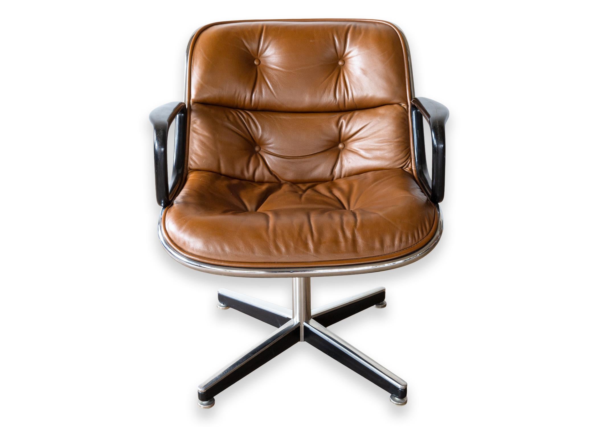 A pair of executive chairs from Knoll. A gorgeous set of Charles Pollock chairs featuring a rich brown leather upholstery. These chairs are in fantastic condition. They look gorgeous, and sit incredibly comfortable. Each chair features the iconic