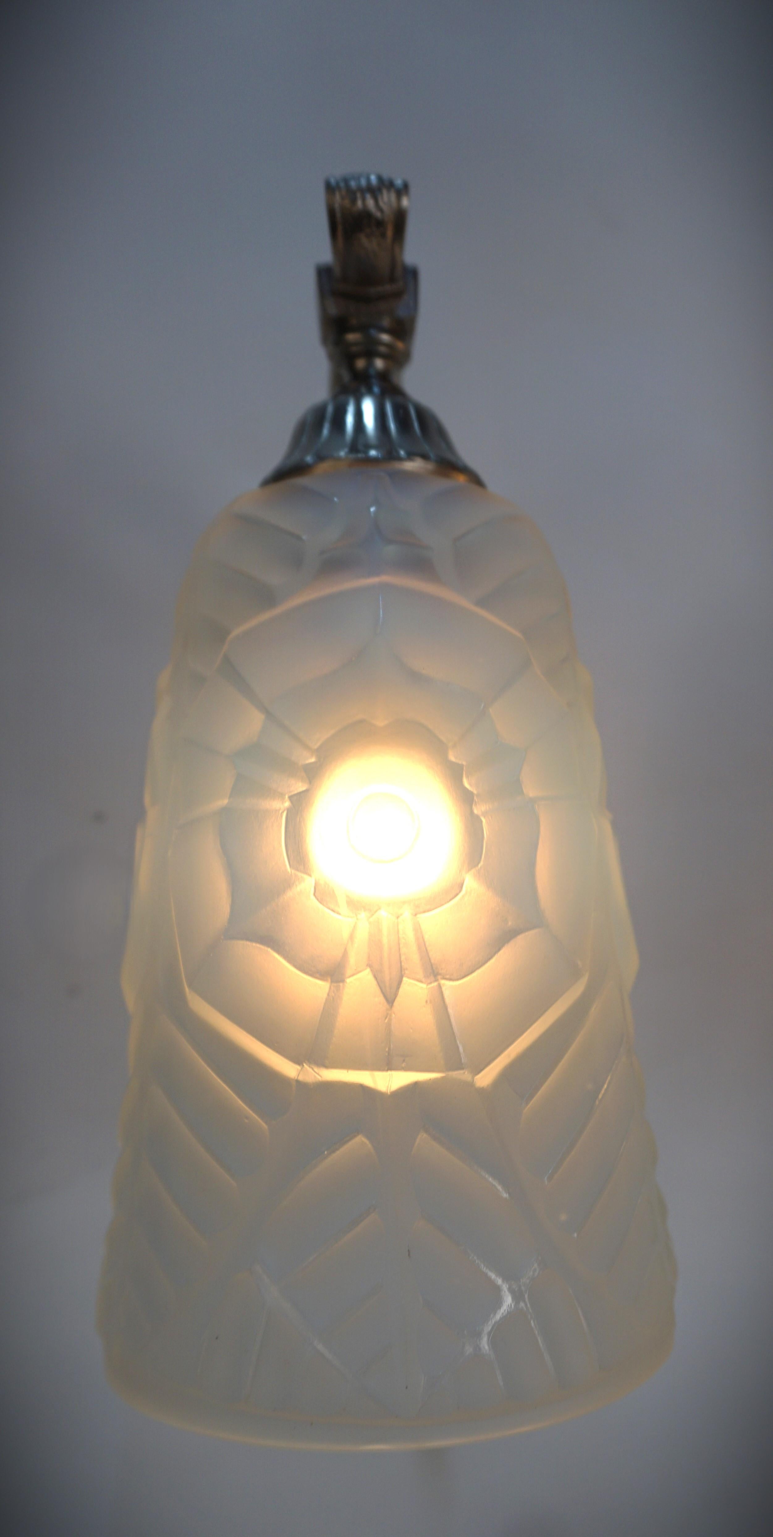 
Pair of 1930's opaline glass with satin nickel on bronze wall sconces by Charles Ranc.
Backplate measurements are 3.75