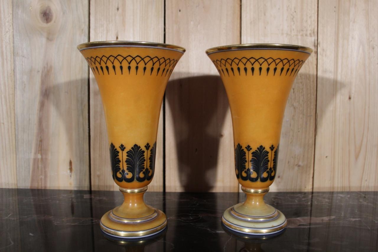 pair of opaline Baccarat cornet vases from the Charles X period in good condition, wear to the color on one foot
