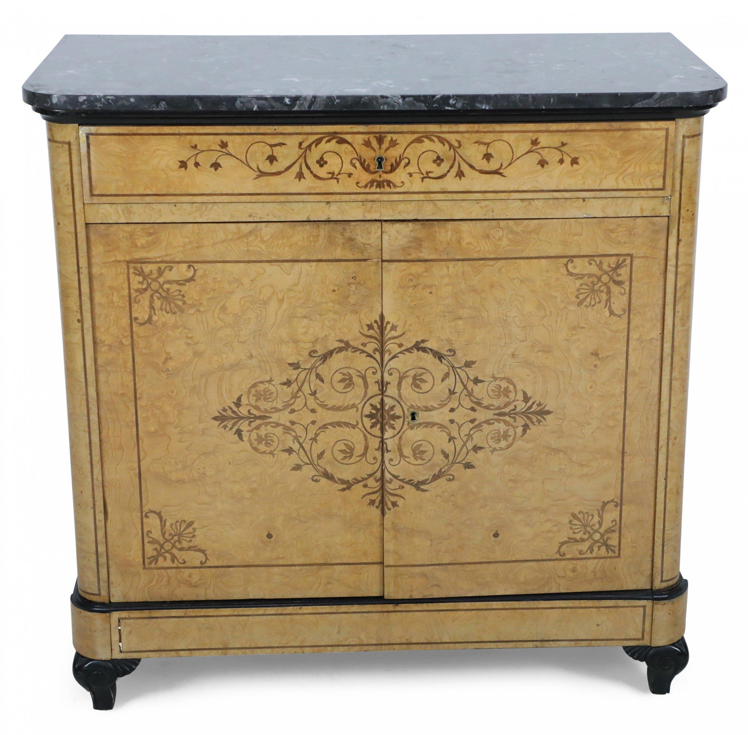 Pair of Charles X two-door commodes with burl maple veneer and inlaid marquetry trim and having bronze keyholes and a single top drawer under a black round edged rectangular marble top. (PRICED AS PAIR).
 