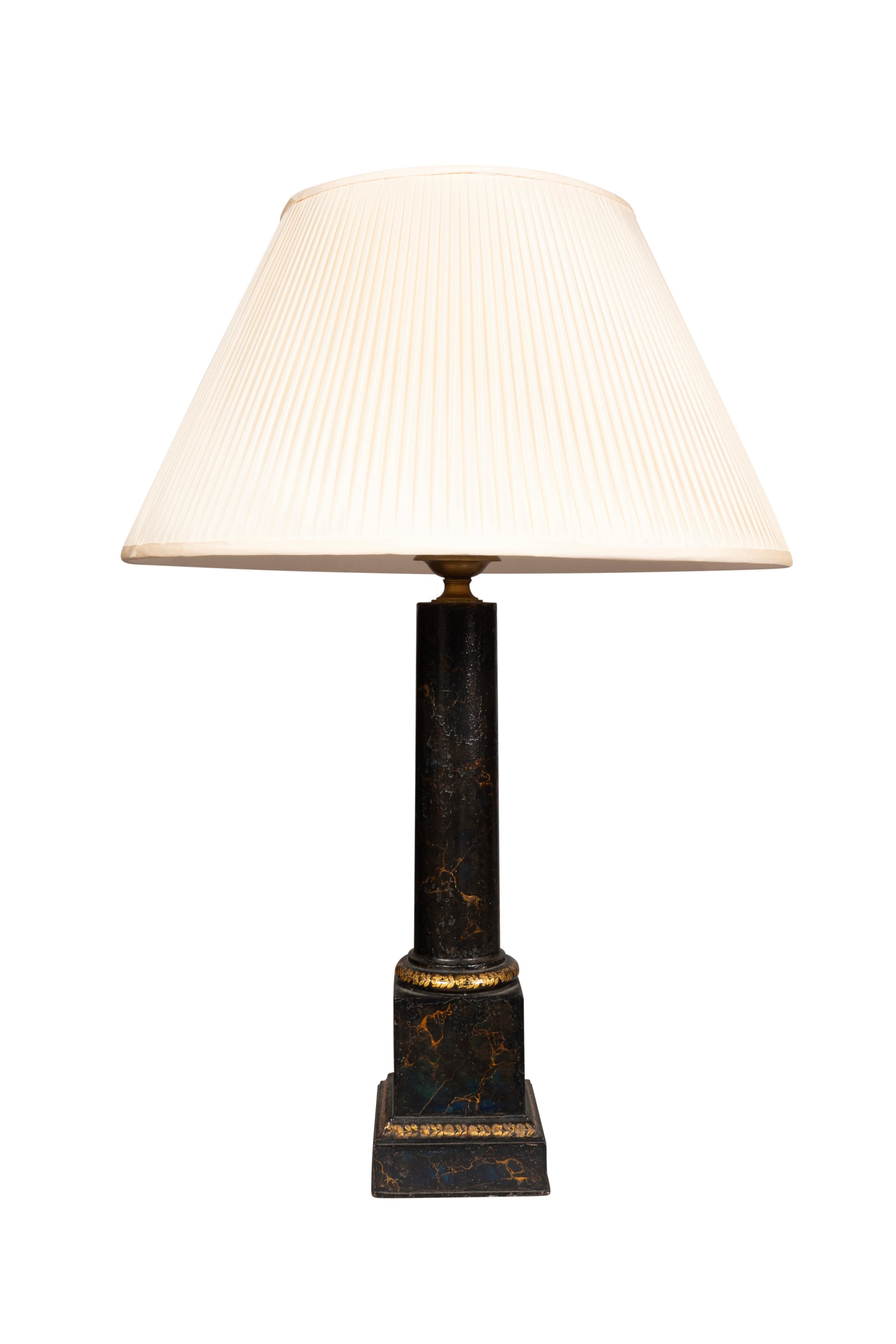Columnar form and painted black with gilt highlights. Signed by maker on side of base. Two light with used shades in relatively good condition.