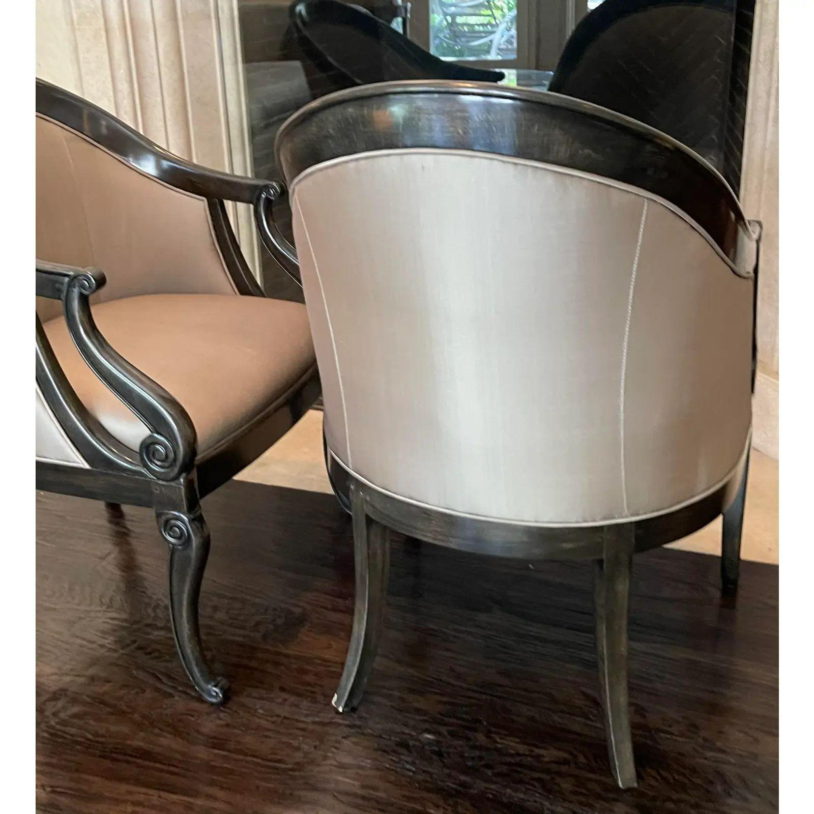 Pair of Art Deco style Sally Sirkin Lewis for J. Robert Scott Club chairs. Each with a barrel form in carved ebony with beige silk upholstery.

Additional information: 
Materials: Ebony, Silk
Color: Black
Brand: William Switzer
Designer: