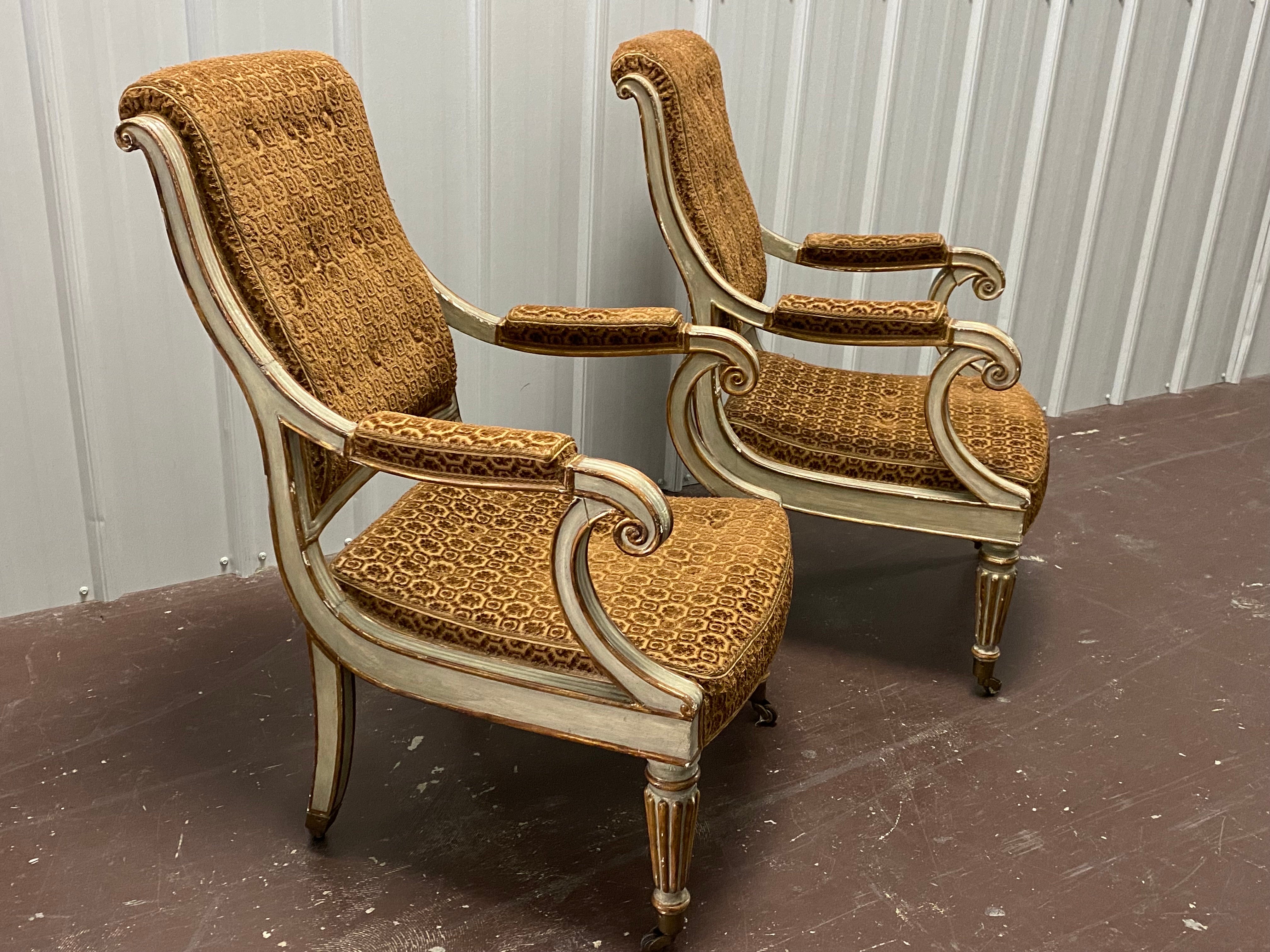 Pair of Charles X Velvet Painted & Parcel Gilt Armchairs, sourced by repute, David Easton. French Grey painted chairs with parcel gilding along edges, and reeding on front legs. Curved back with a gentle rolled back edge, arms scroll to front, back