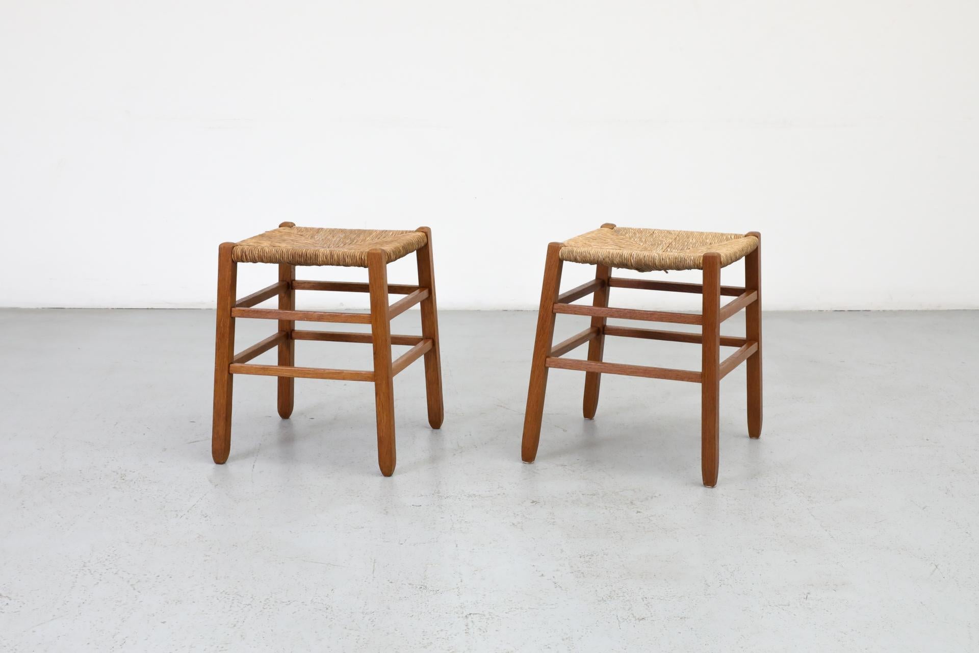 Pair of Charlotte Perriand Inspired Primitive Oak Stools with Rush Seats In Good Condition In Los Angeles, CA