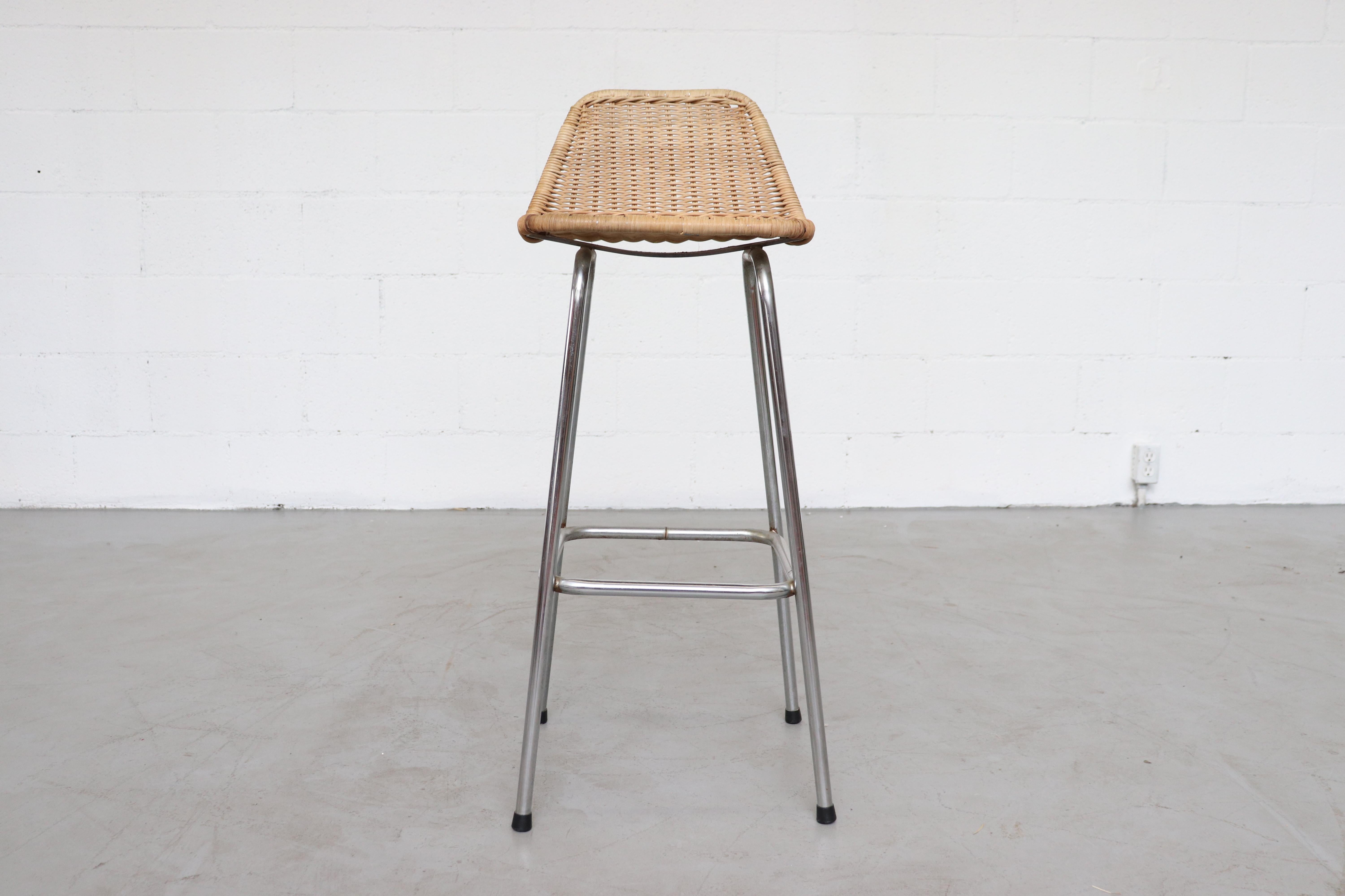 Charlotte Perriand inspired wicker and chrome metal bar stools with angled seat back. In original condition. Some may have weld discoloration marks in spots. All in original condition. Set price.