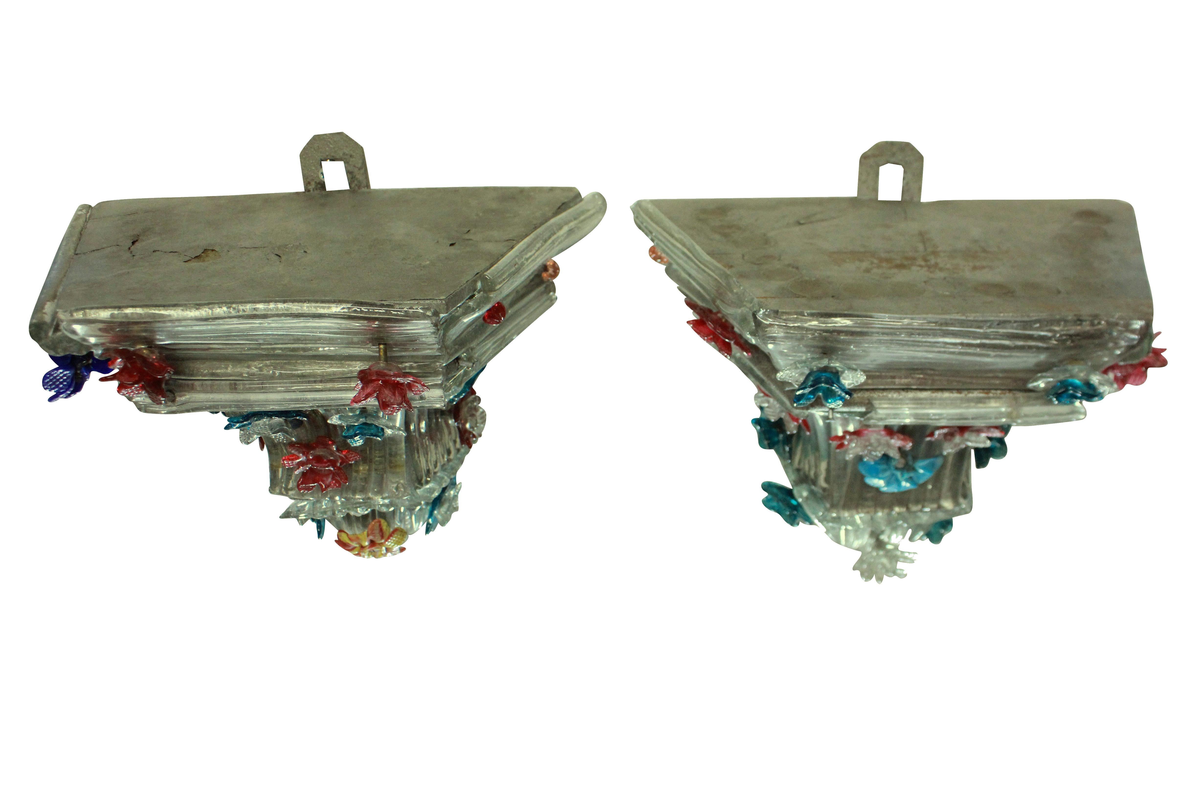 A pair of charming Italian Murano glass wall brackets with colored flowers. Some losses.