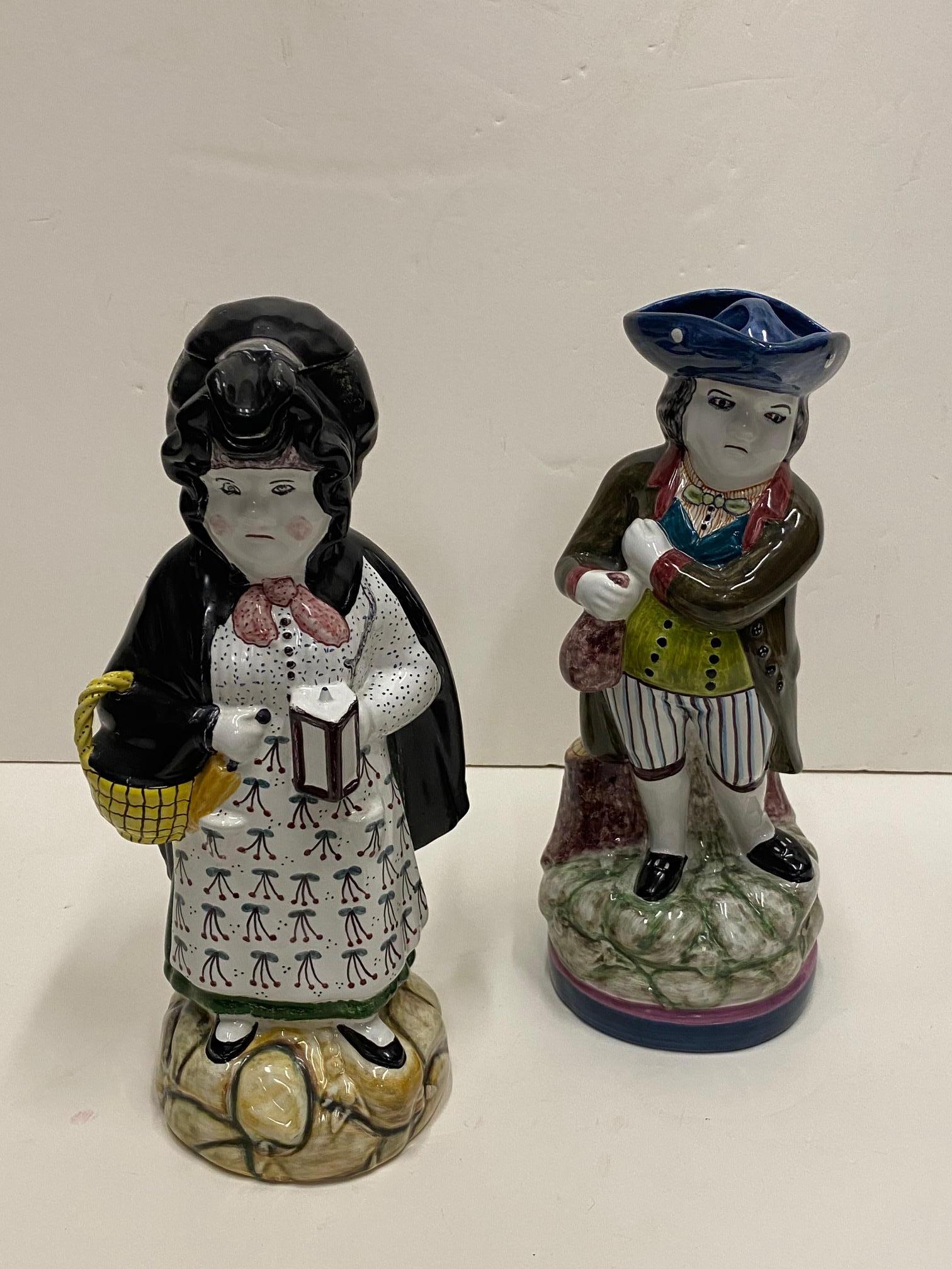 Pair of Portuguese glazed pottery figural toby pitchers that make a handsome couple. The hats come off on both.
Signed on bottom.
female 15 x 7.