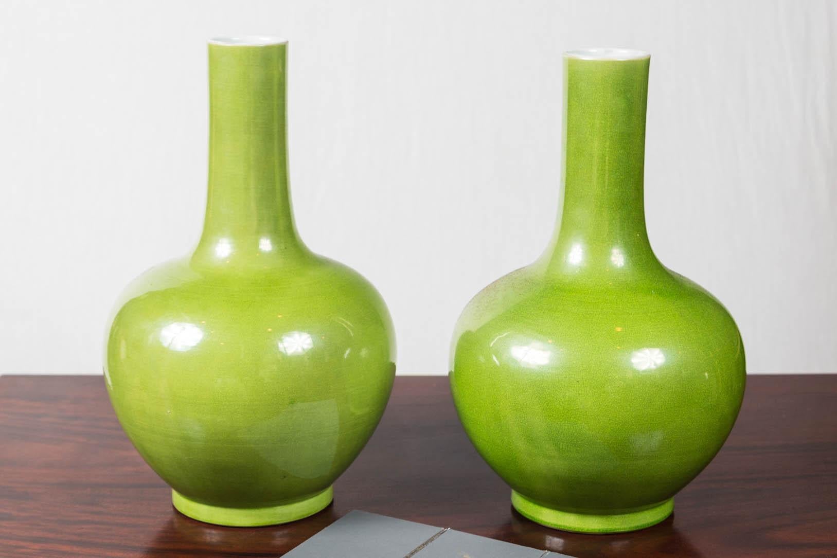 Chinese bottle shape vases in a brilliant yellow/green glaze.
unmarked.