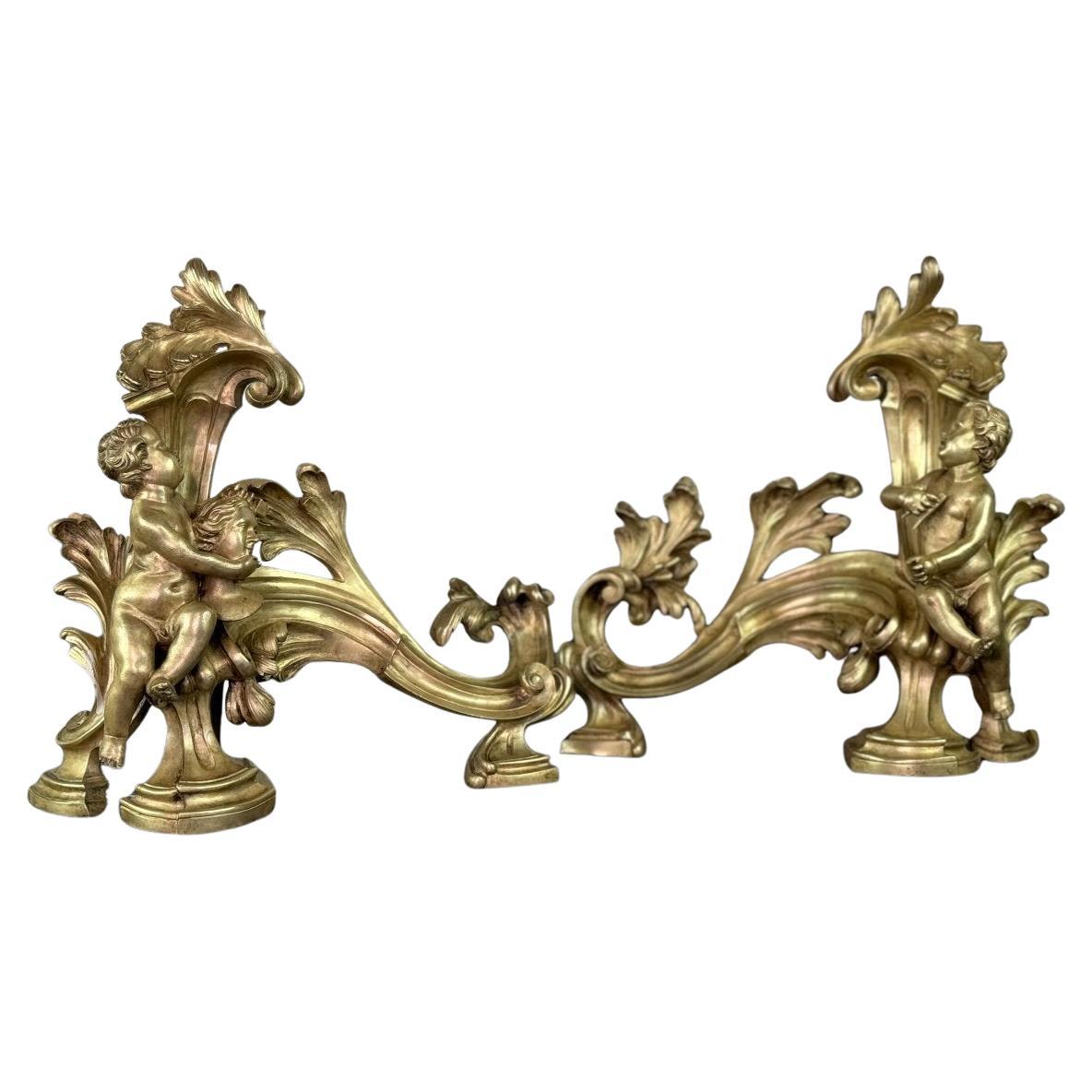 Pair Of Chased And Gilded Bronze Chenêts After A Model By Jacques Caffieri