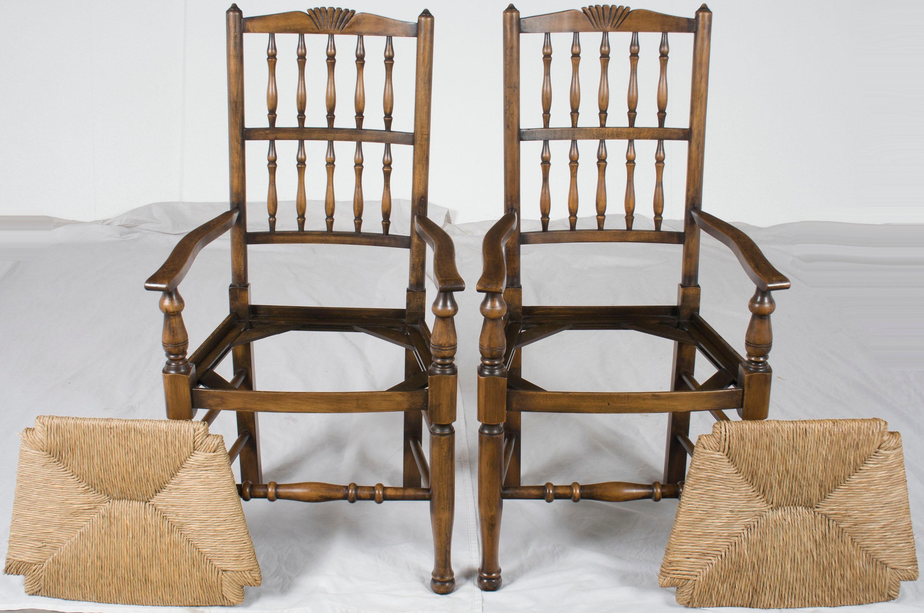 This lovely pair of English country dining chairs would look great in any kitchen or breakfast nook. Their country style is accented with splendid rush seats that are quite comfortable.

This set comes from England and was made there recently.