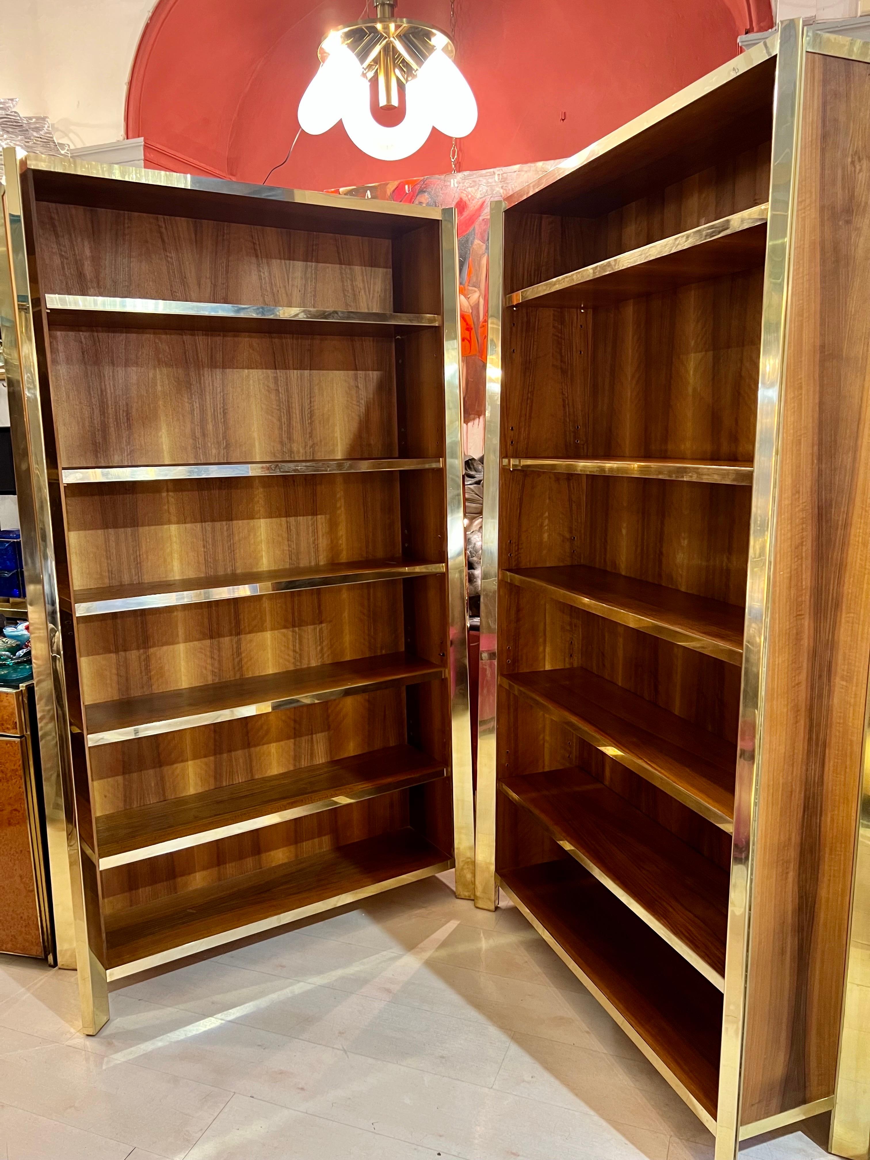 Pair of Cherry wood bookcases with brass profiles and 5 shelves with brass edges. The Italian manufacture is functional and high quality pieces of furniture captured the innovative spirit in furniture design of the 1980s.
Can be sold